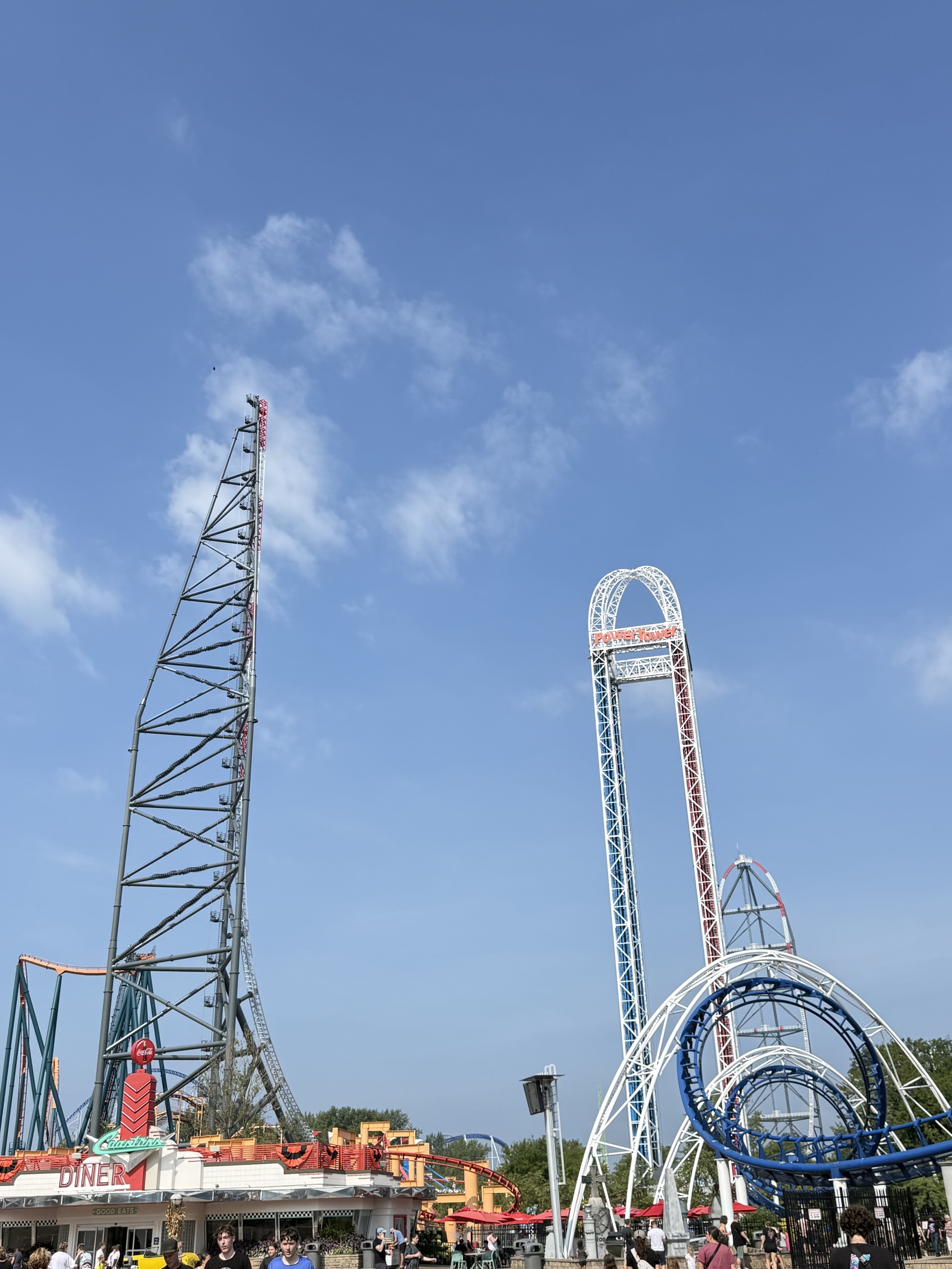 The Cedar Point skyline from the front midway: the Top Thrill 2 spike and top hat and Corkscrew's loop