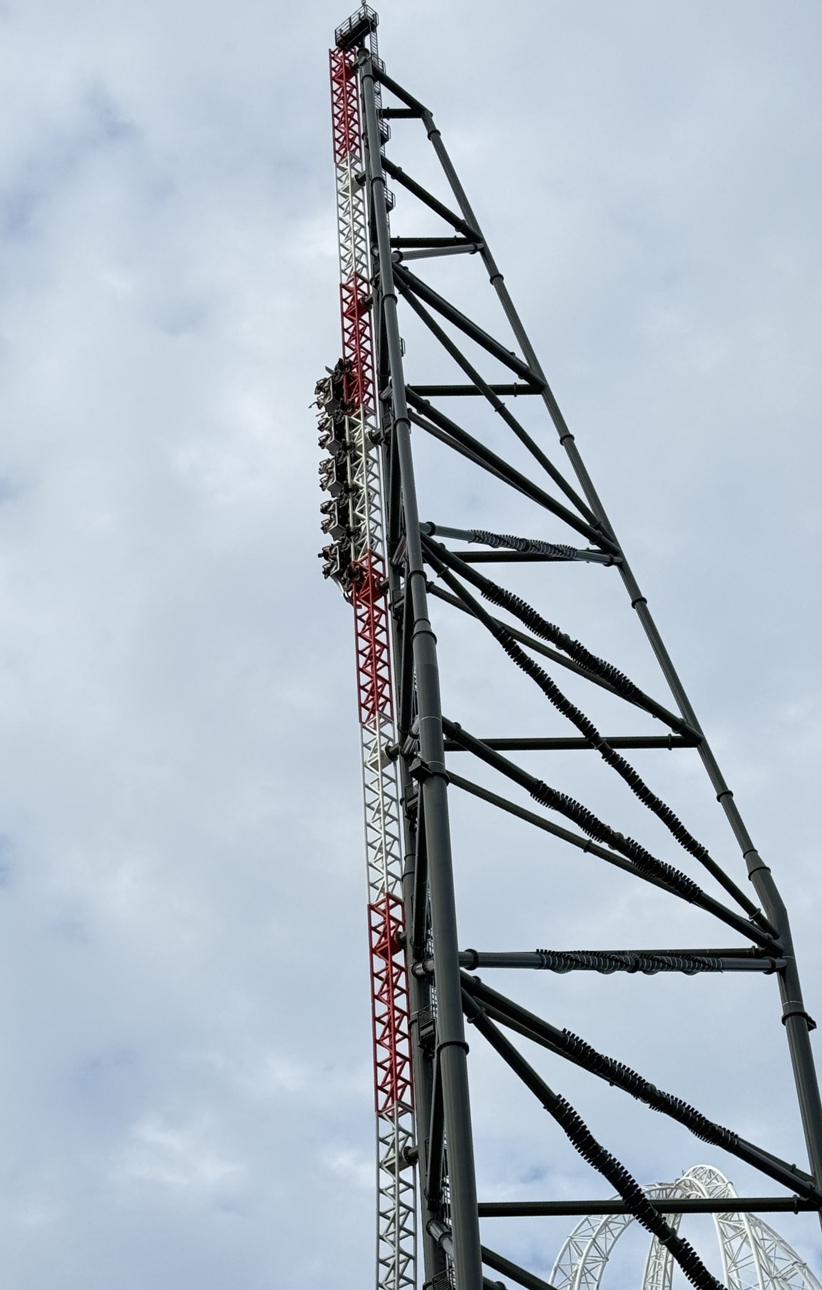 A Top Thrill 2 train near the top of the spike with the Cedar Point sign below