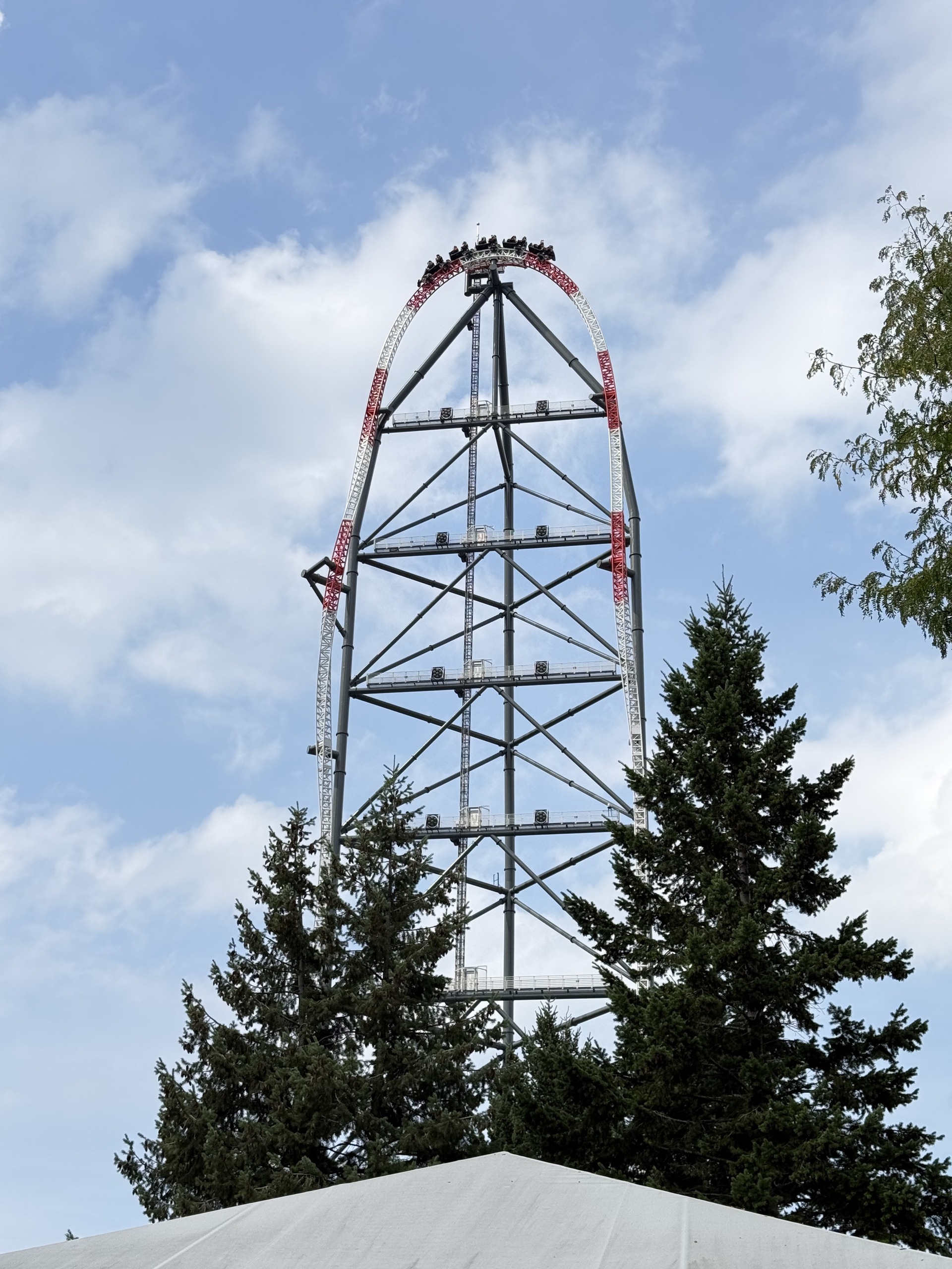 A Top Thrill 2 train silhouetted at the top of the spike