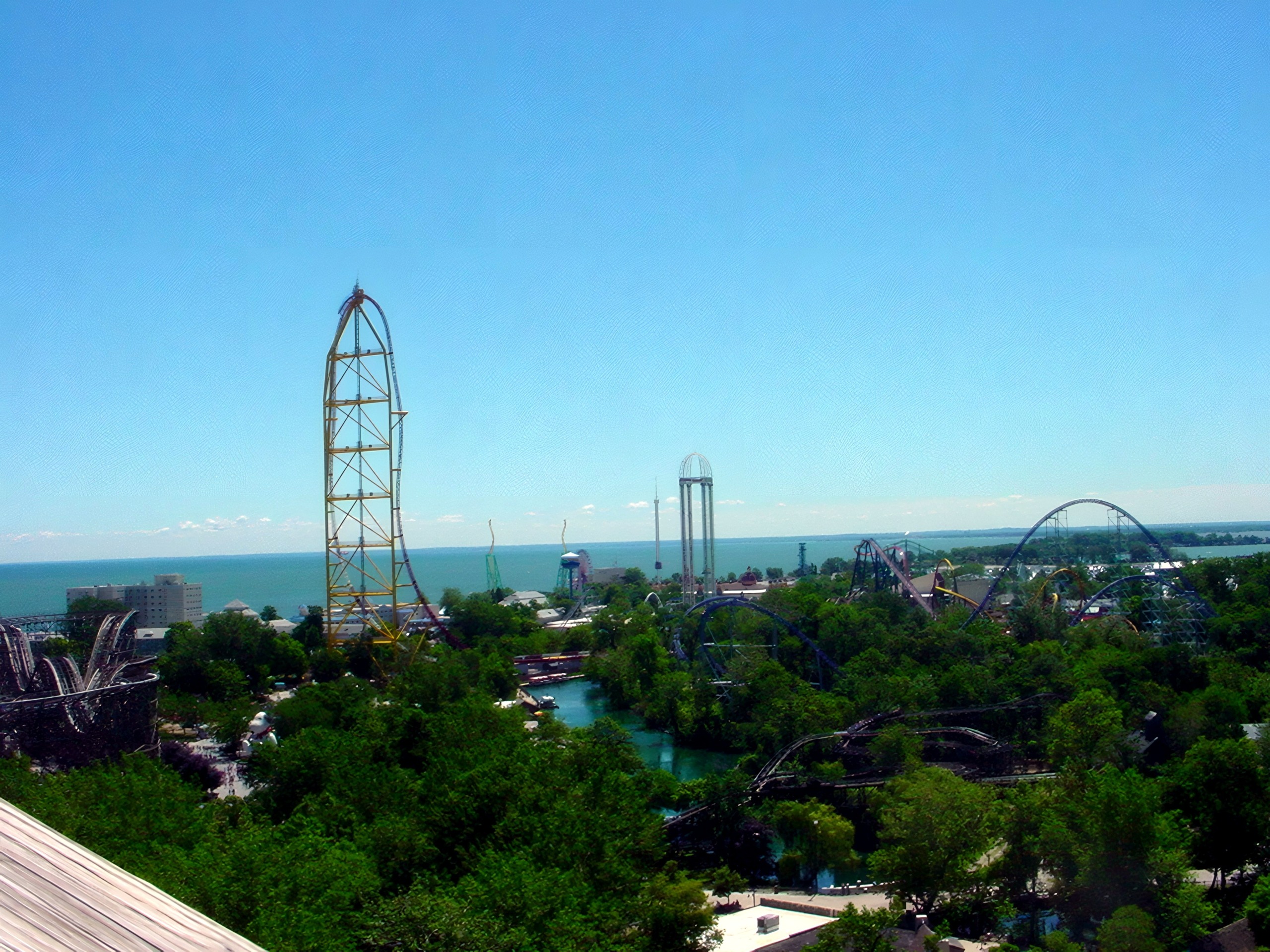 Aerial view of tall launch tower and park skyline by lake, Top Thrill Dragster, July 2003