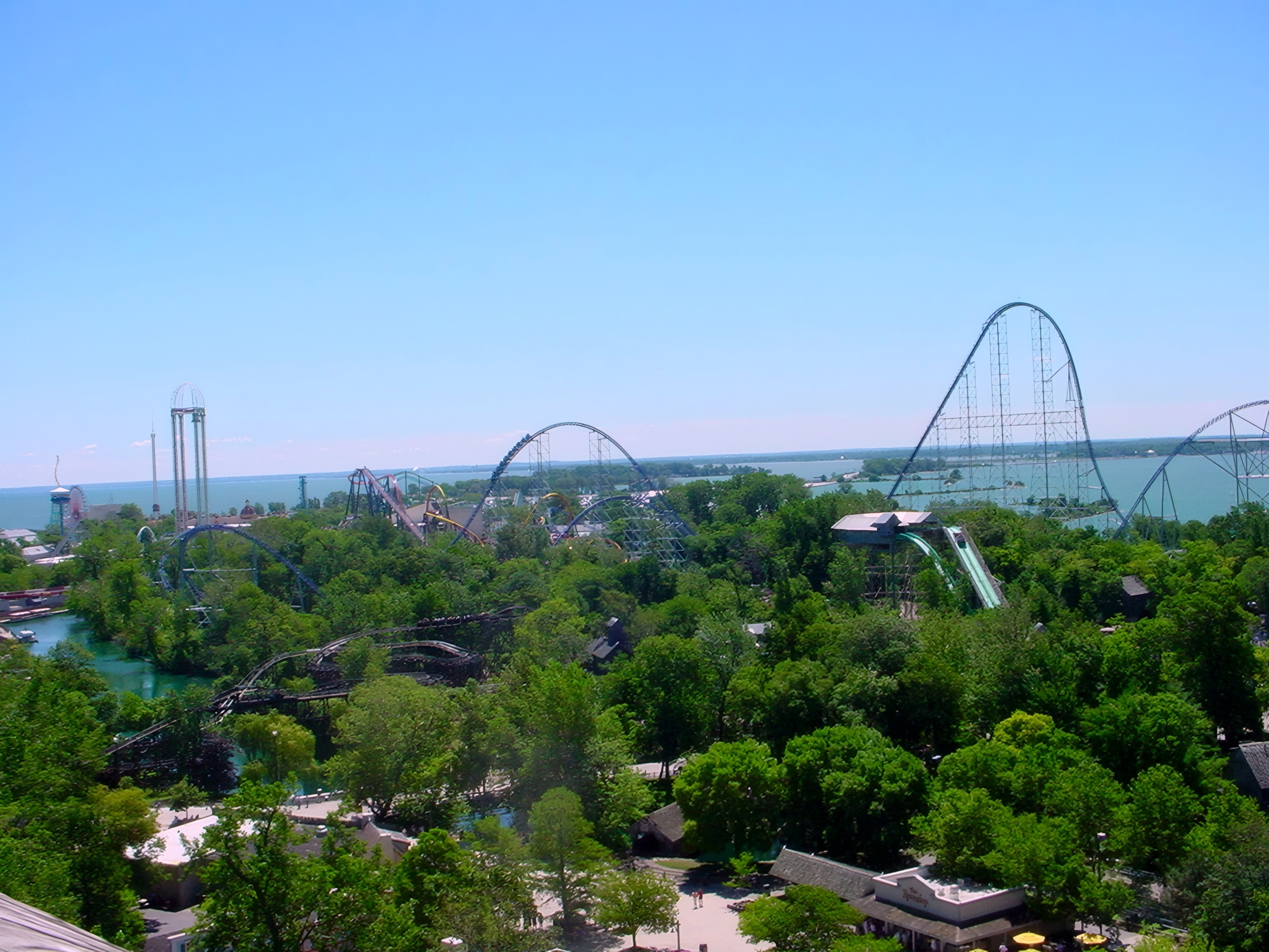 Wide aerial view of park skyline with multiple coasters, lake, Top Thrill Dragster, July 2003