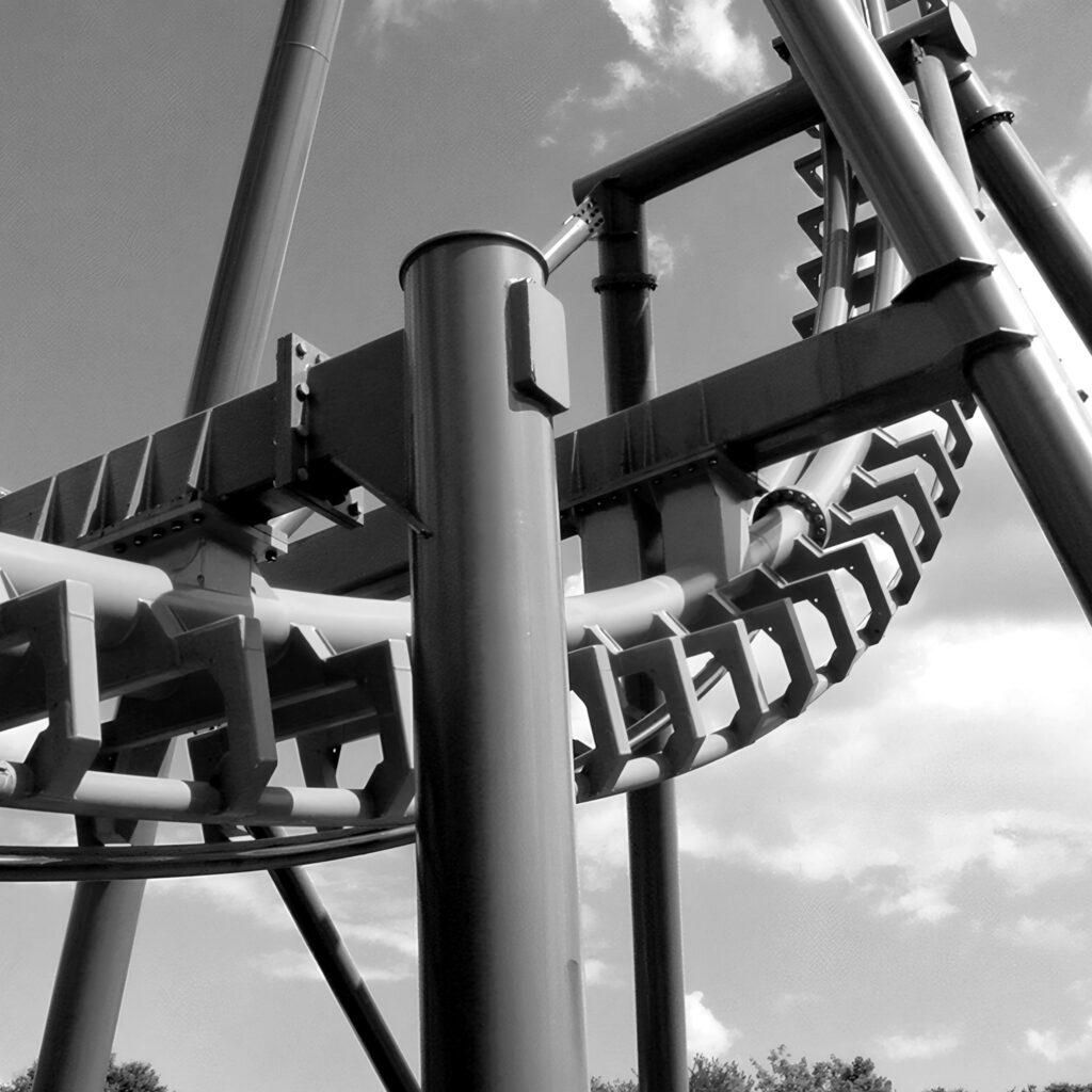Two-Face: The Flip Side's track twisting through its teal supports, Six Flags America, July 2001