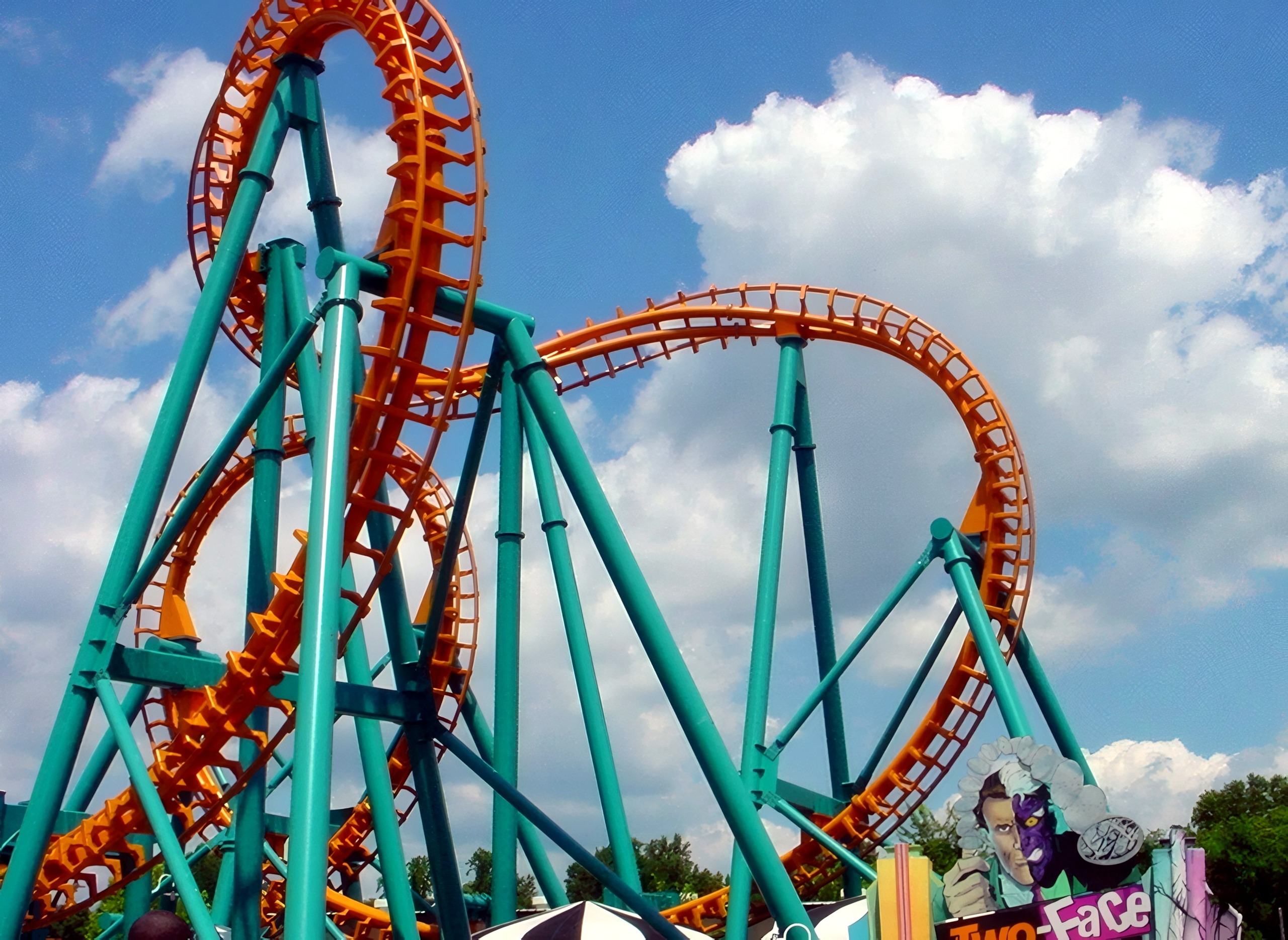 The Two-Face: The Flip Side loop and track above the entrance sign at Six Flags America, July 2001
