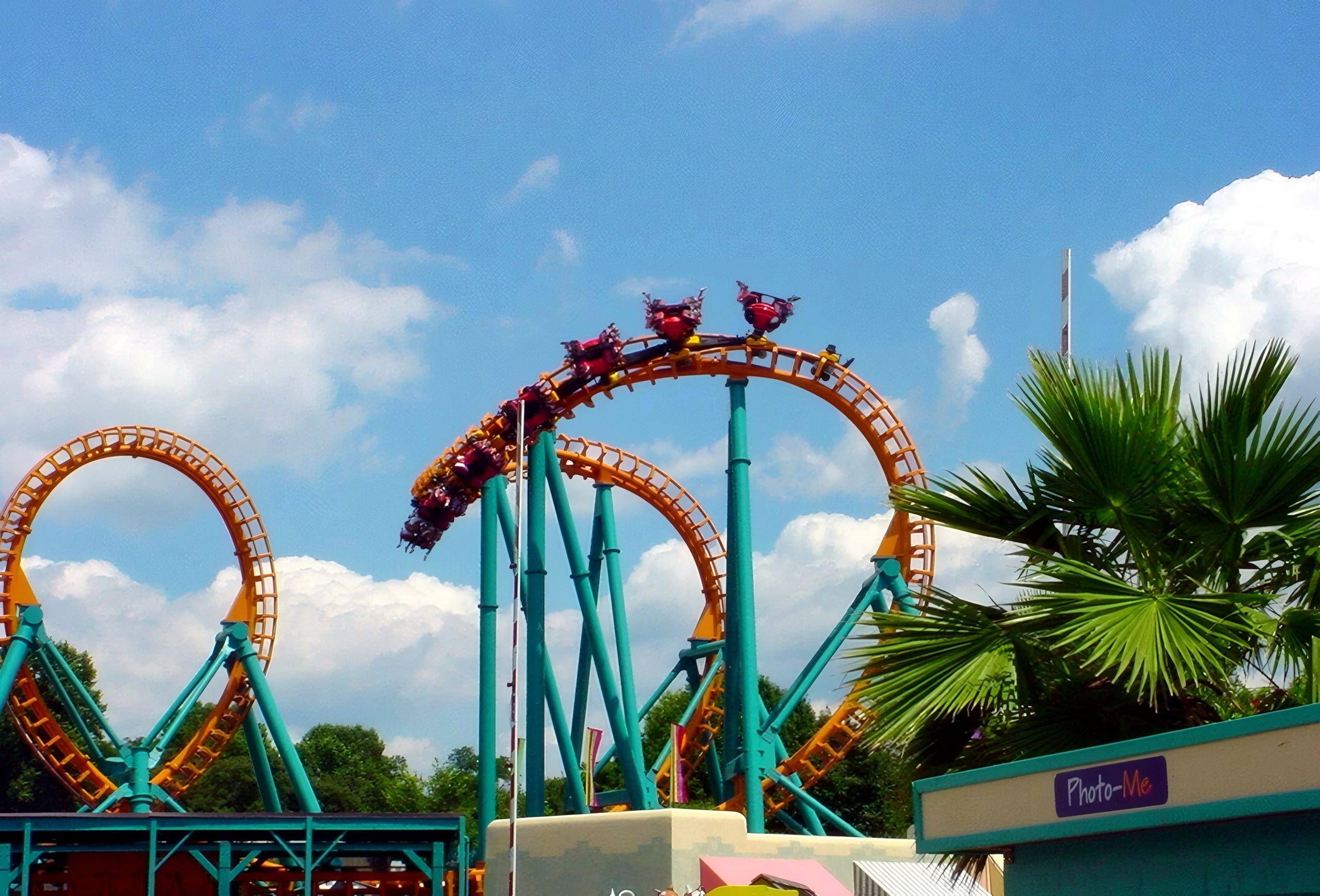 A Two-Face: The Flip Side train hanging in the inversion above the midway at Six Flags America, July 2001