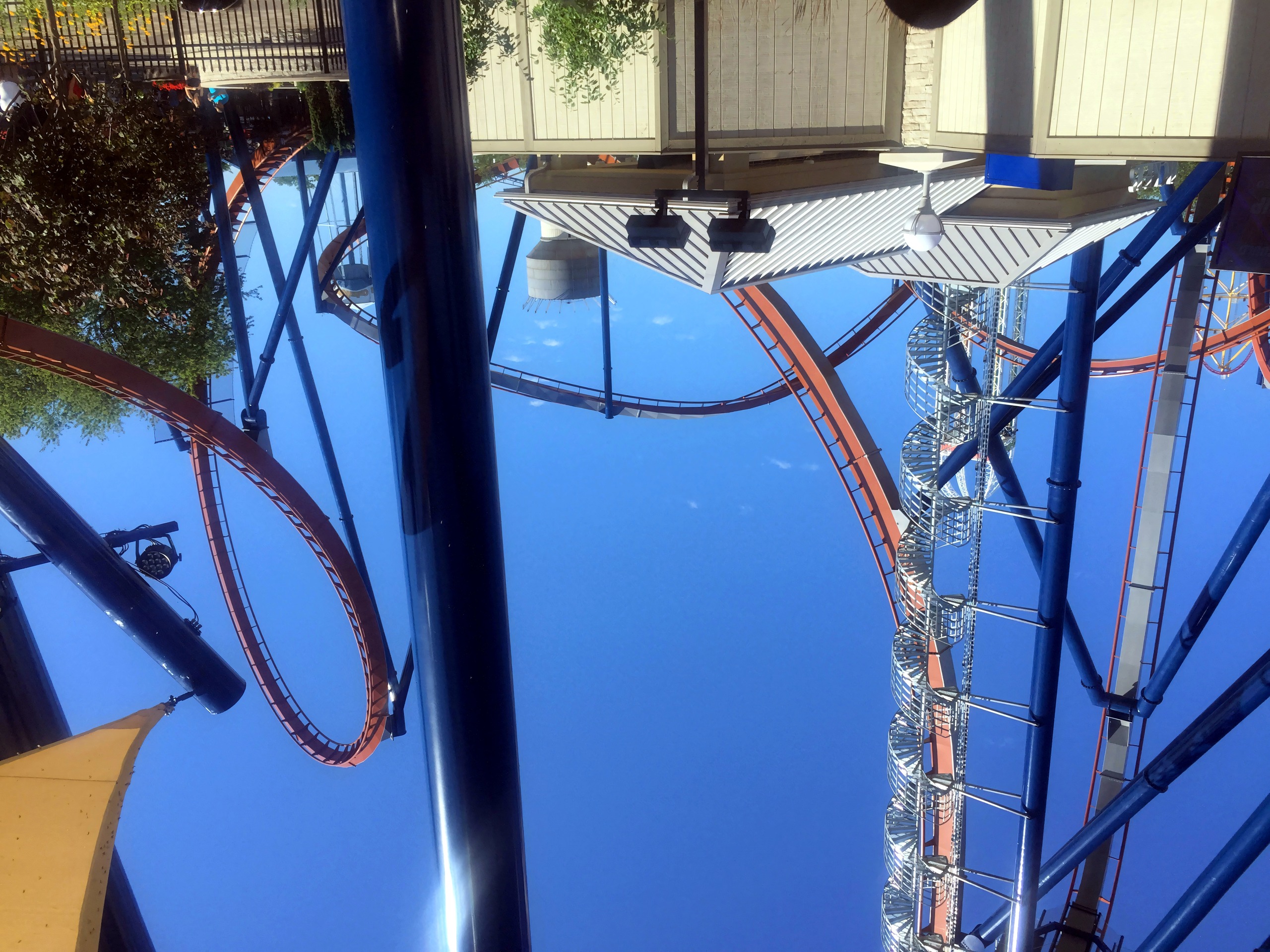 Raptor lift hill and loop above entrance plaza shade sail, Valravn, July 2016
