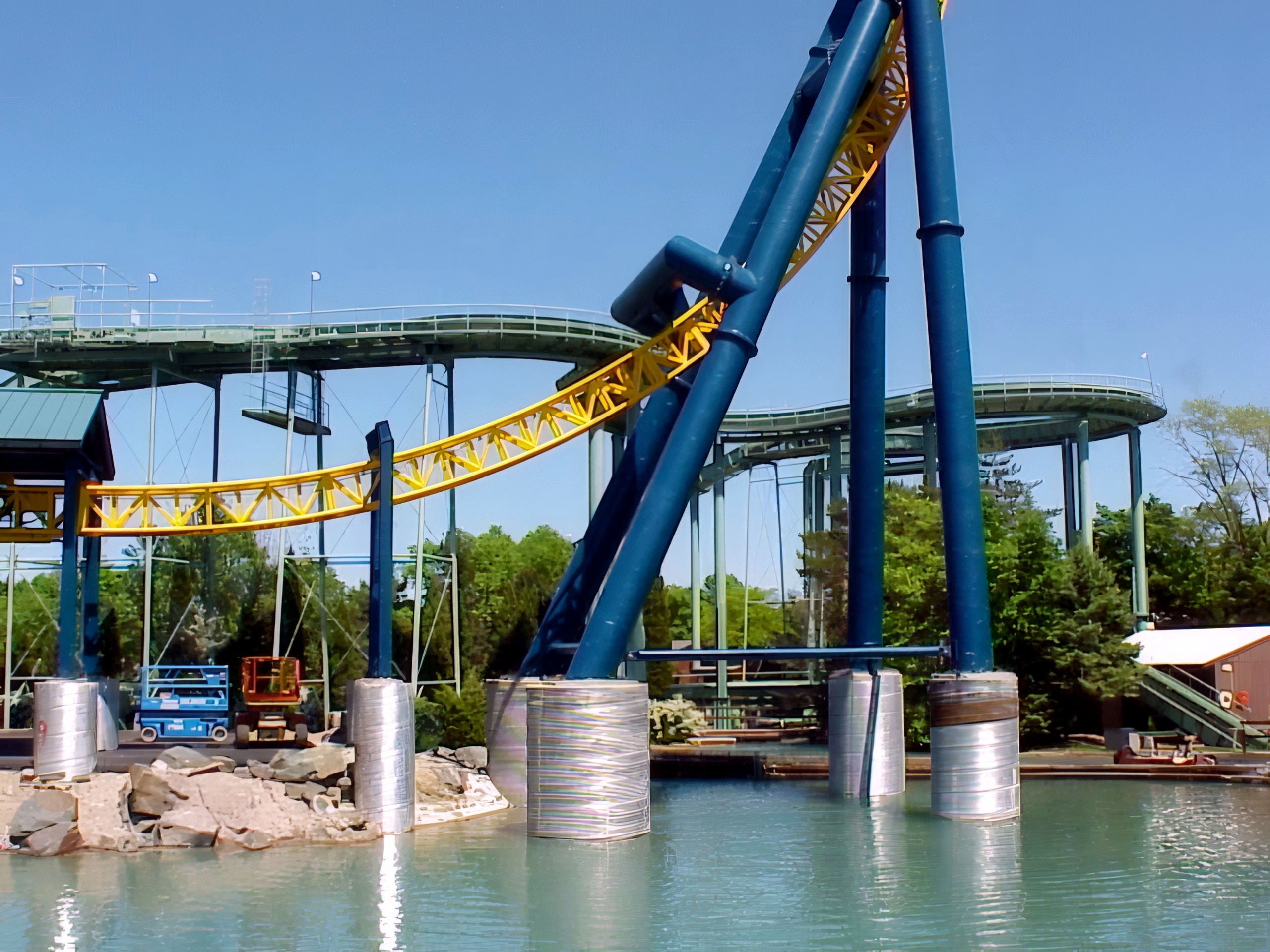 Vertical Velocity's yellow track and blue supports over the pond at Six Flags Great America