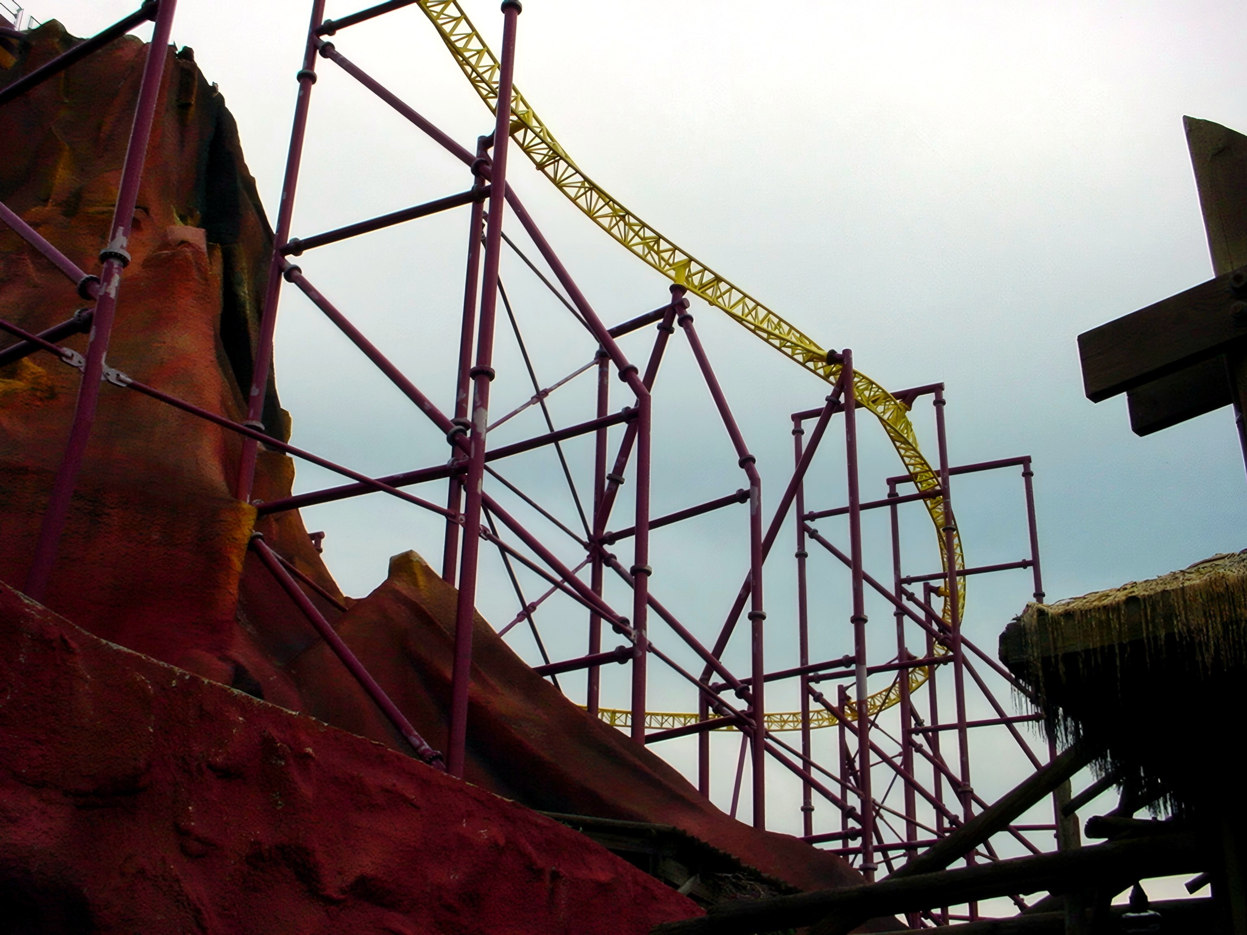 Volcano's track and support scaffolding under a cloudy sky, July 2001