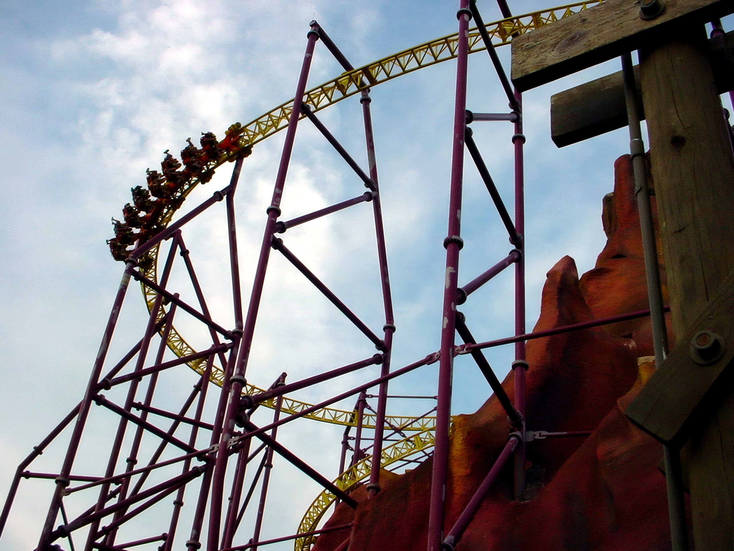 A Volcano train cresting the yellow track on maroon supports, July 2001