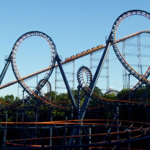 Vortex roller coaster at Kings Island with a train climbing the lift between its two vertical loops