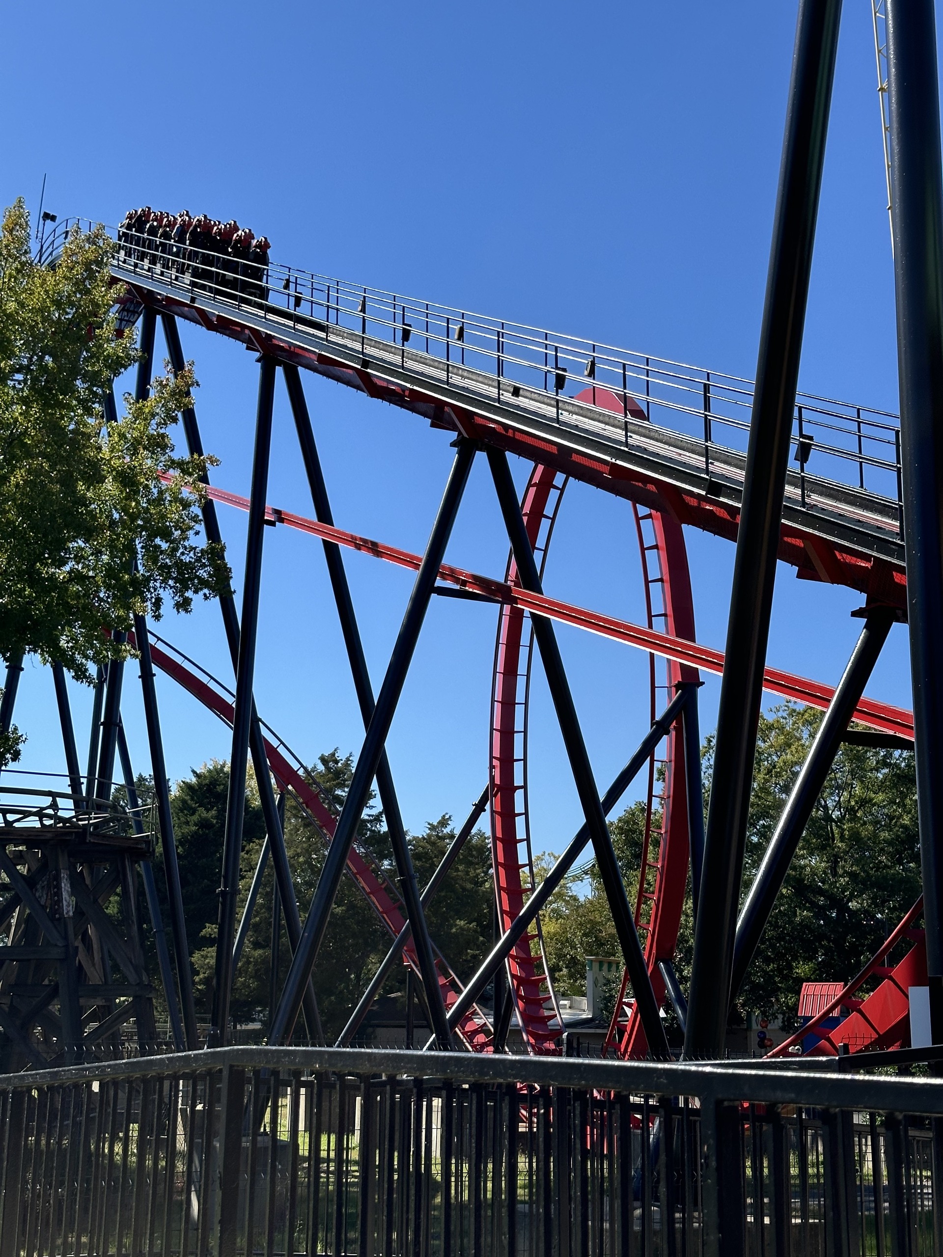 A Vortex train at the top of the lift hill, Carowinds, October 2024