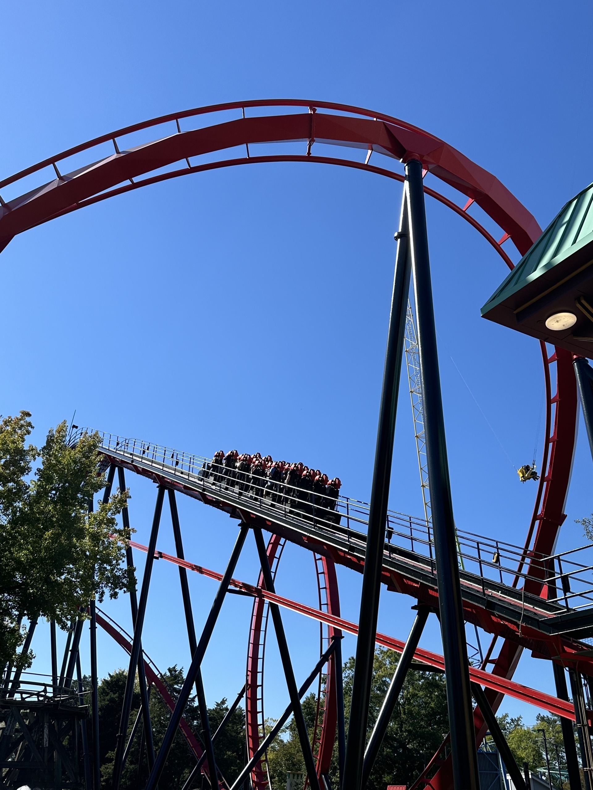 A Vortex train high on the lift hill below the loop, Carowinds, October 2024