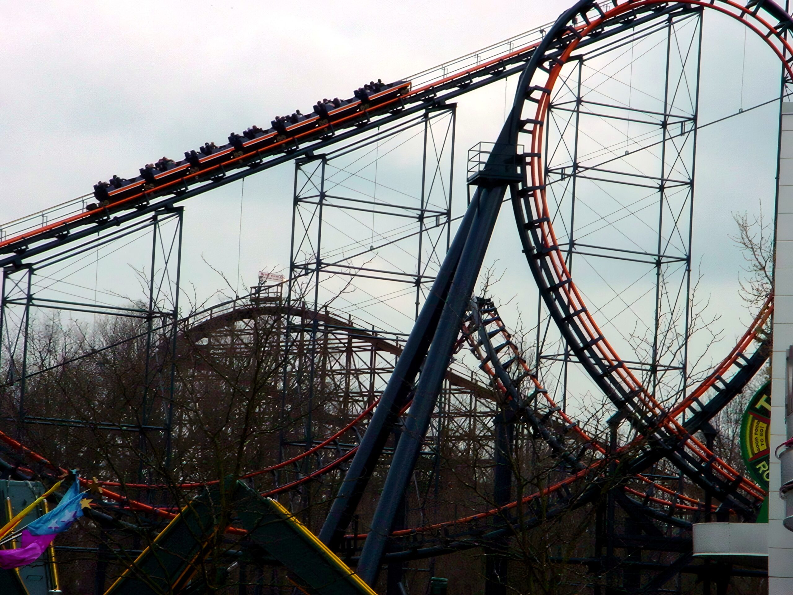 A Vortex train on the lift hill with a vertical loop in front, April 2002