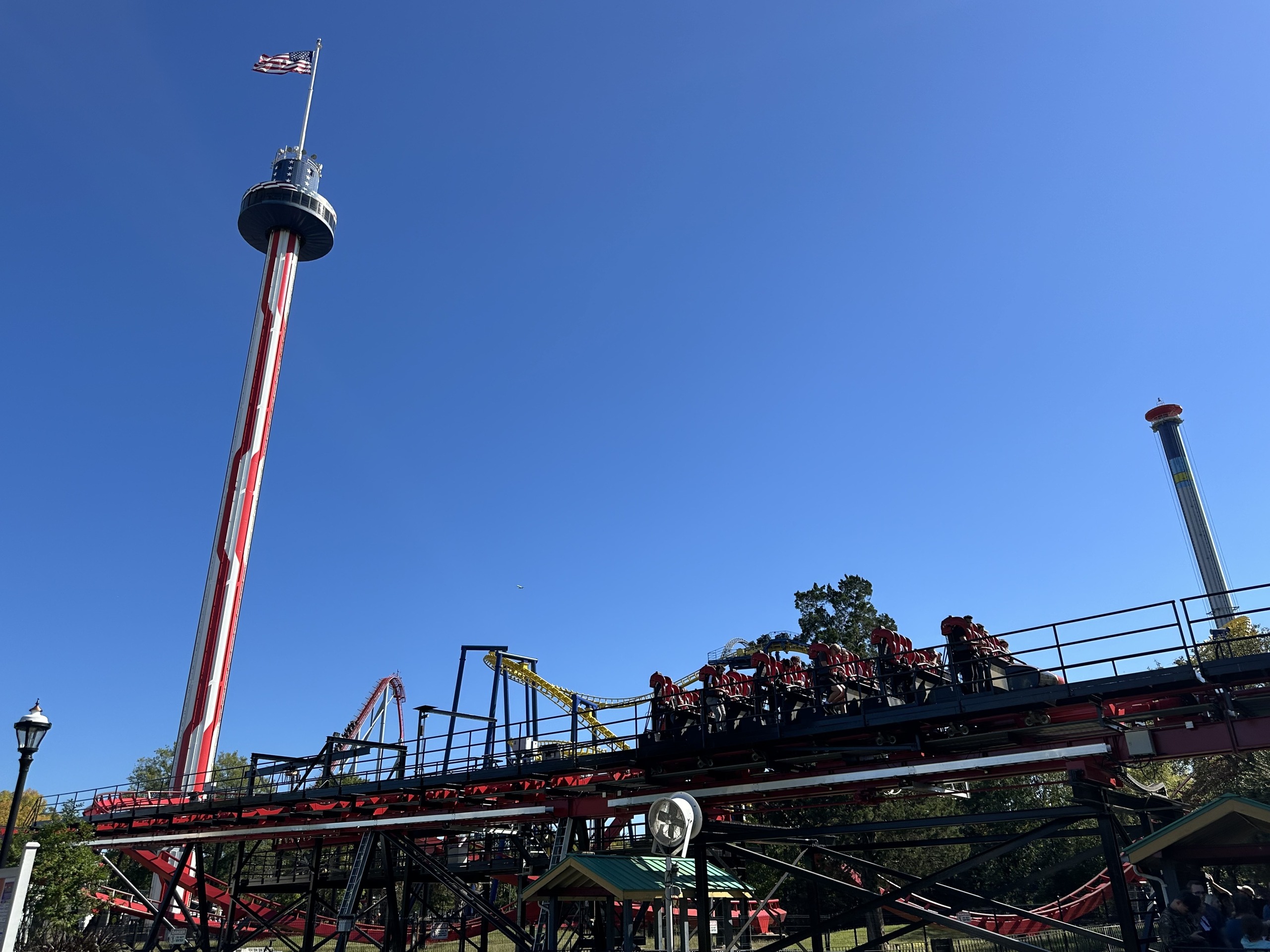 A Vortex train on the lift with the observation tower behind, Carowinds, October 2024