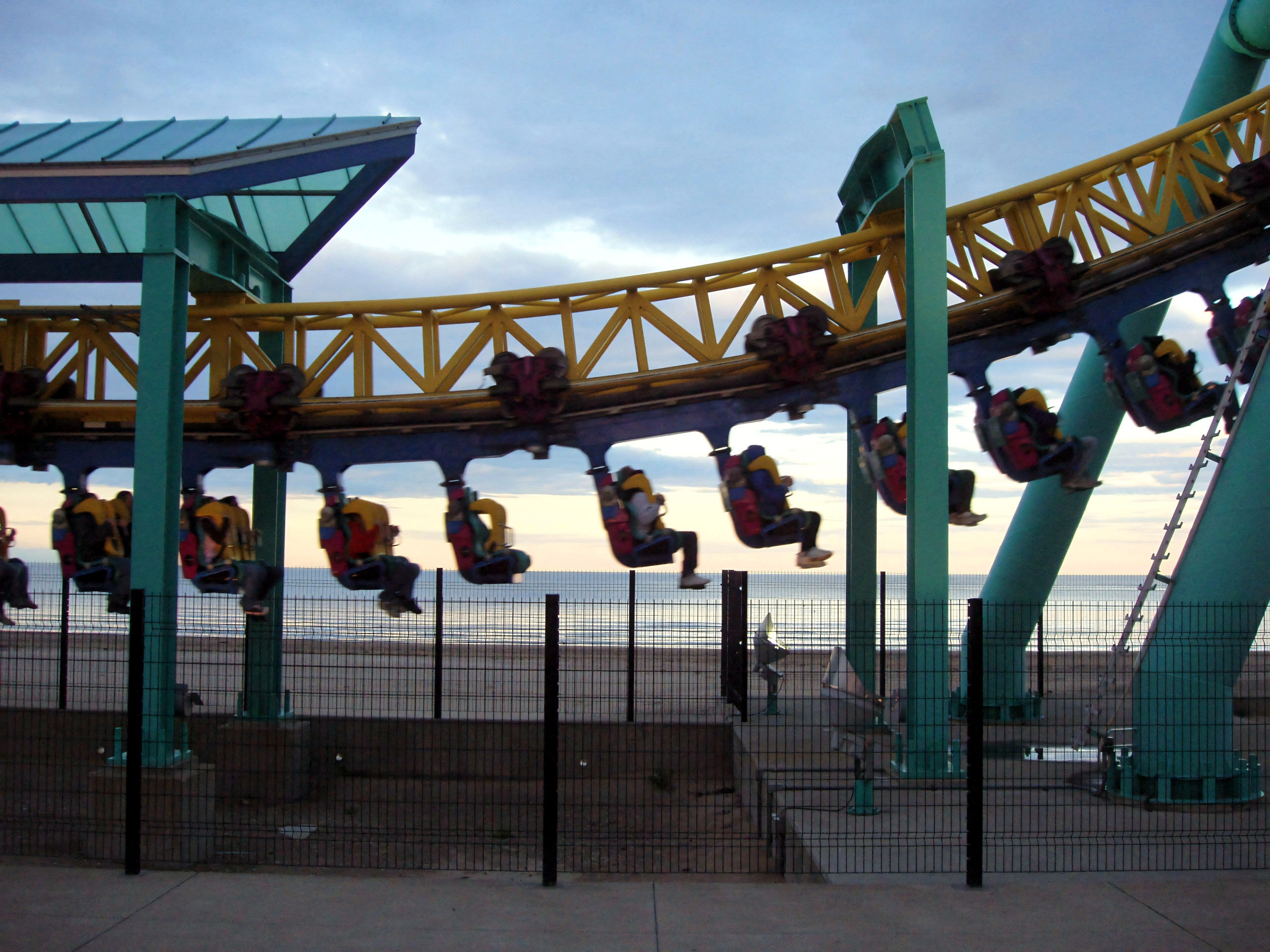 Suspended coaster track curving above beach at dusk, Wicked Twister, September 2006
