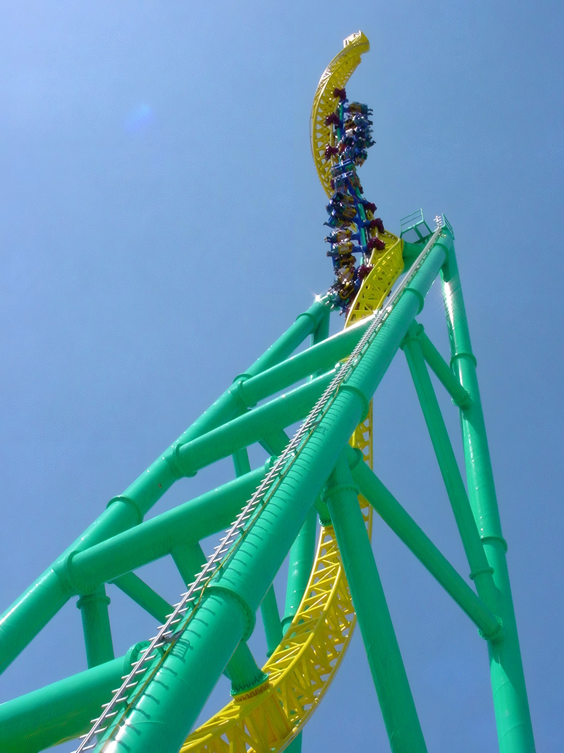 Train at top of twisted tower spike, riders visible, Wicked Twister, May 2002