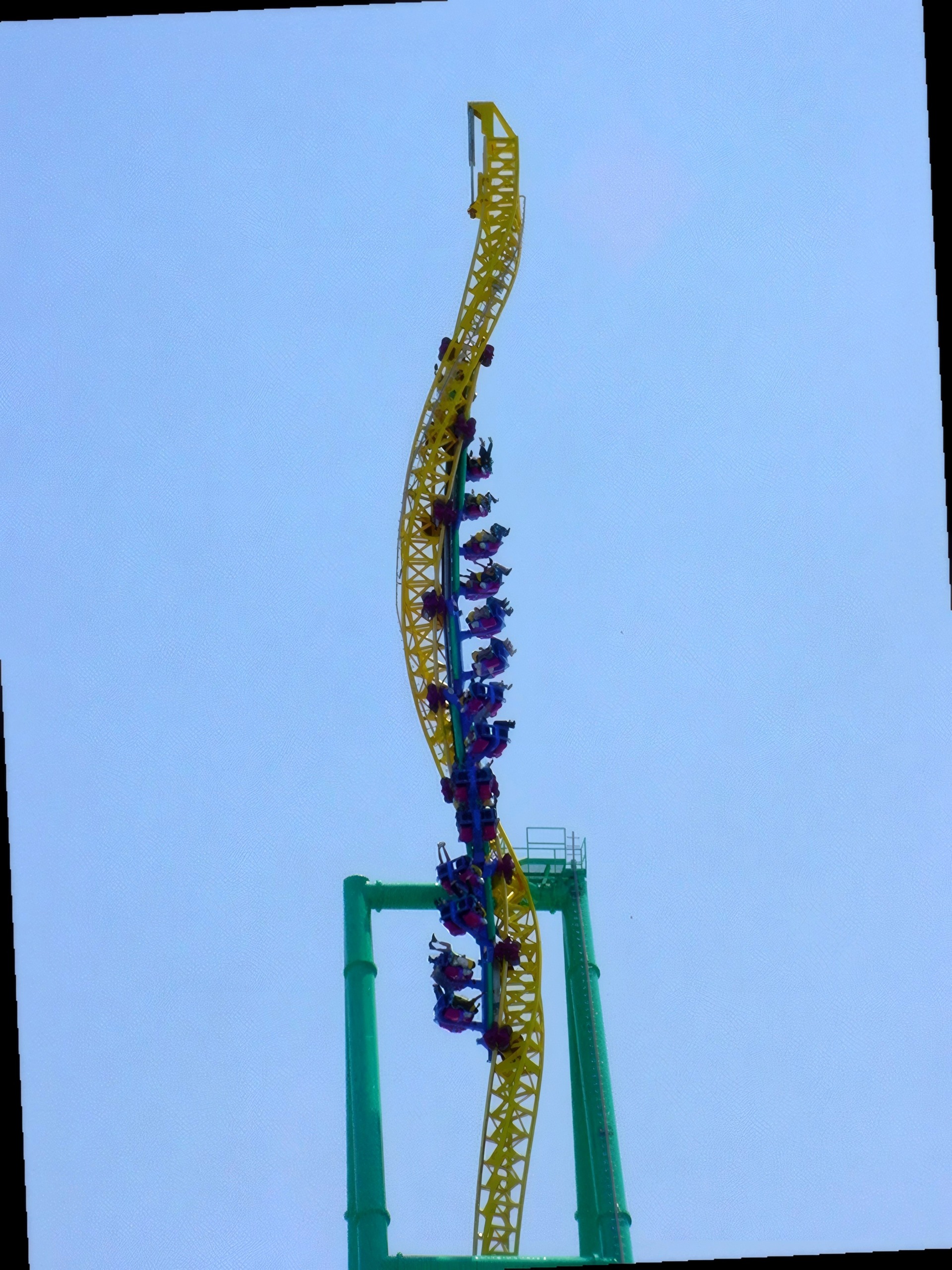 Wicked Twister train climbing twisted tower, riders visible, Wicked Twister, May 2002