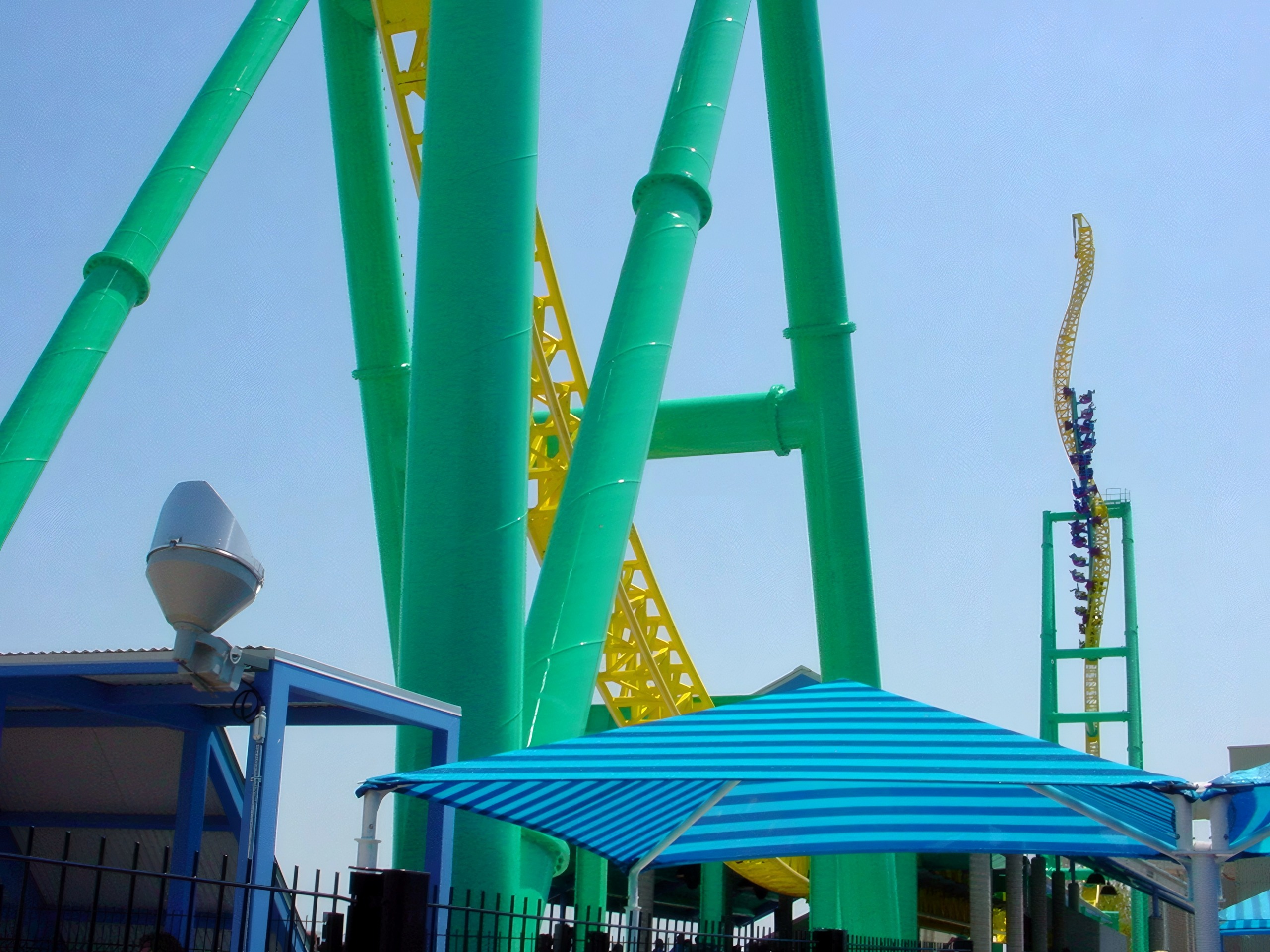 Wide view of both twisted towers with train and canopy, Wicked Twister, May 2002