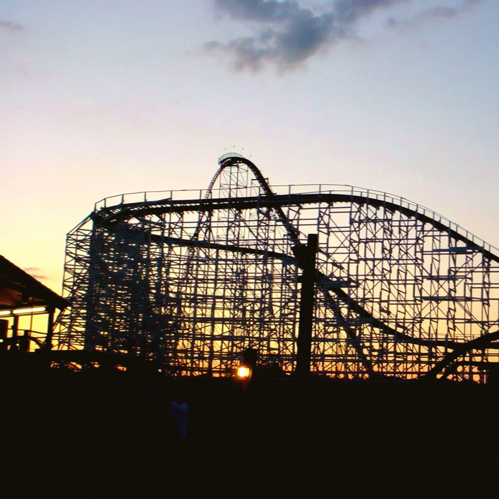 Wild One's wooden structure silhouetted against the sunset at Six Flags America, July 2001