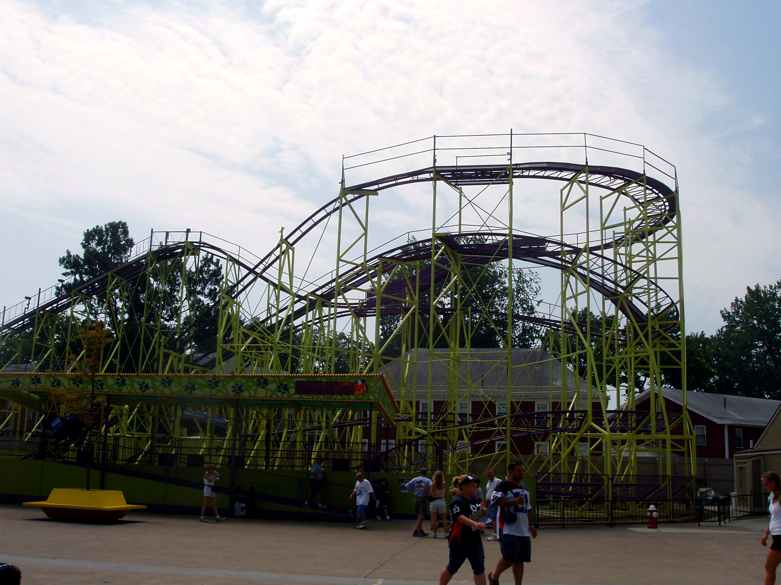 WildCat's green structure and purple track under a hazy sky at Cedar Point, July 2005