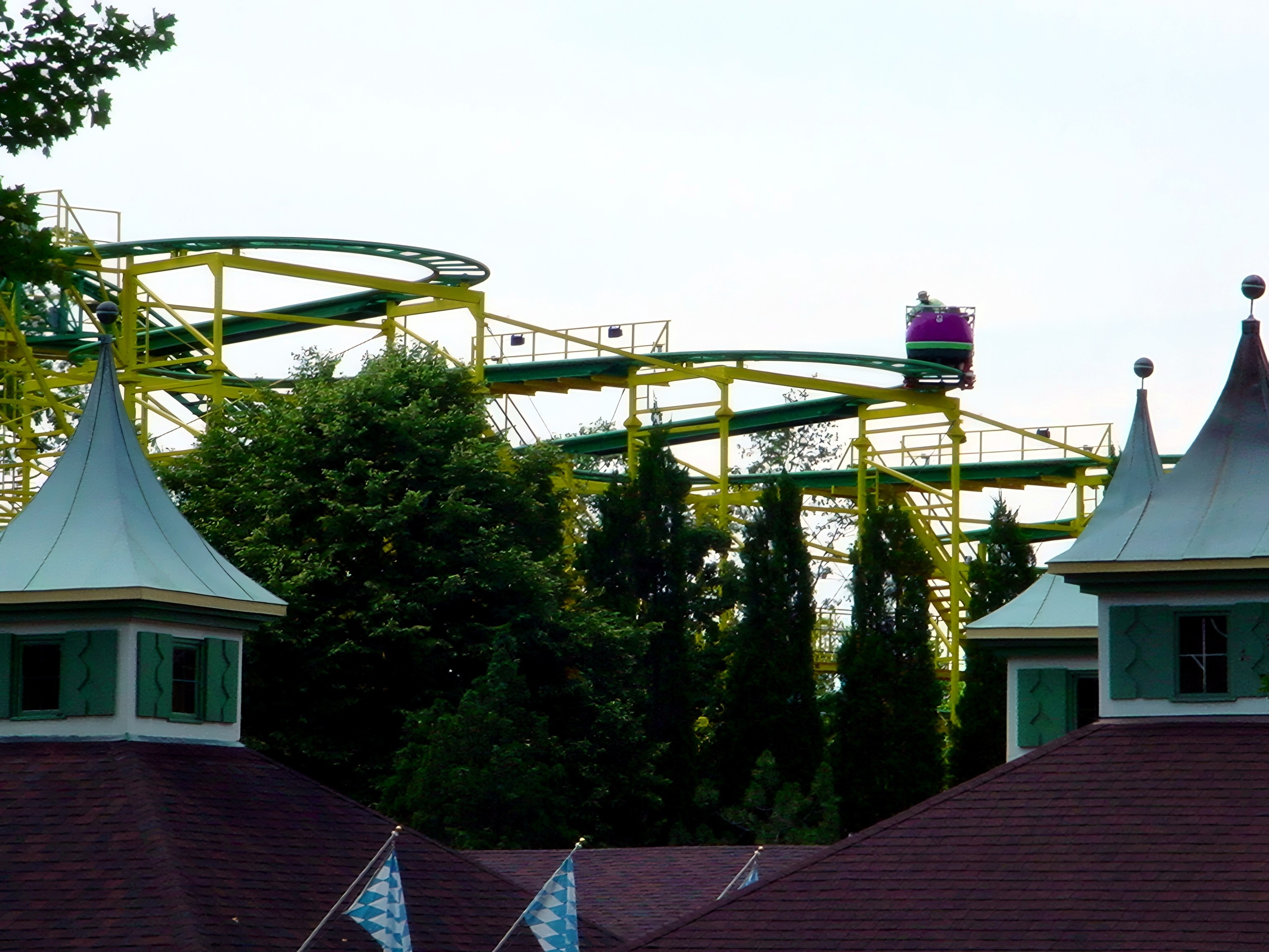 A Wilde Maus car on the upper track above the village rooftops at Busch Gardens Williamsburg, July 2001