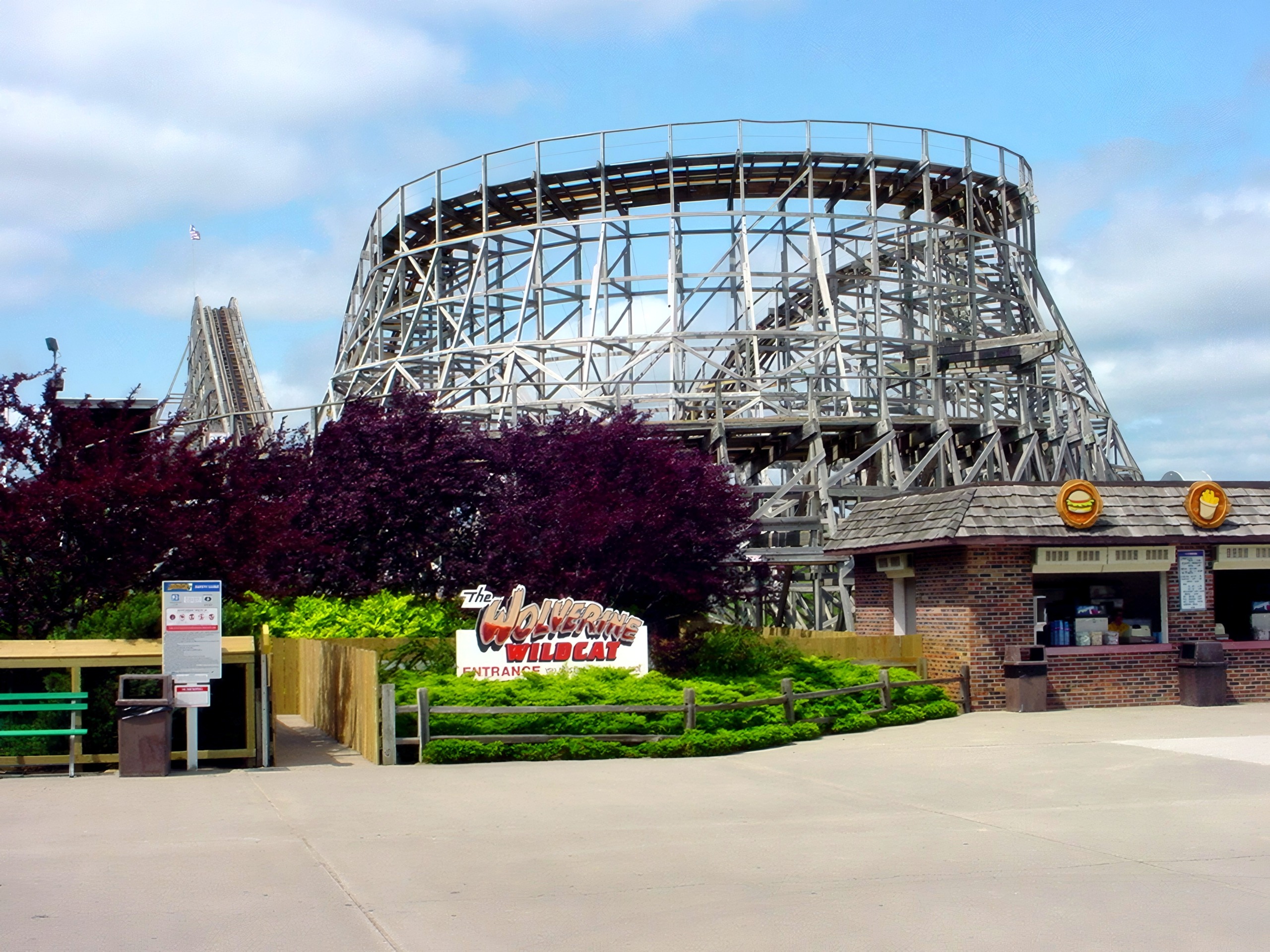The Wolverine Wildcat entrance sign with the wooden structure behind, June 2002