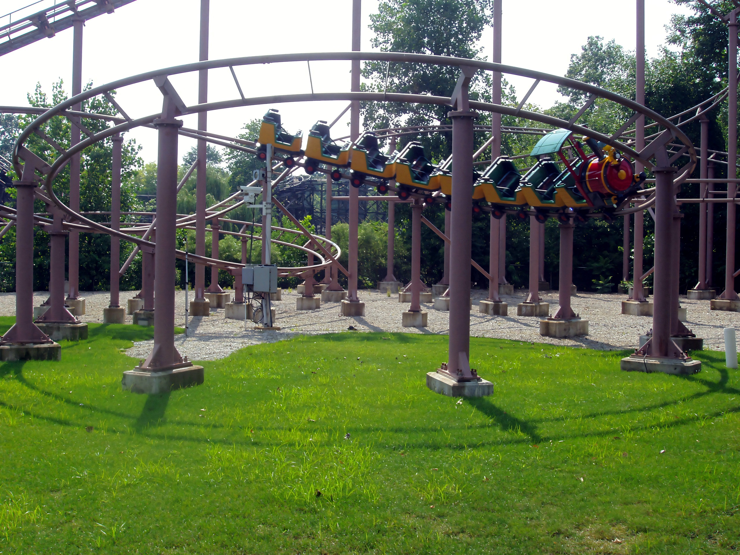 Yellow train coaster banking through overlapping track loops, Woodstock Express, July 2005