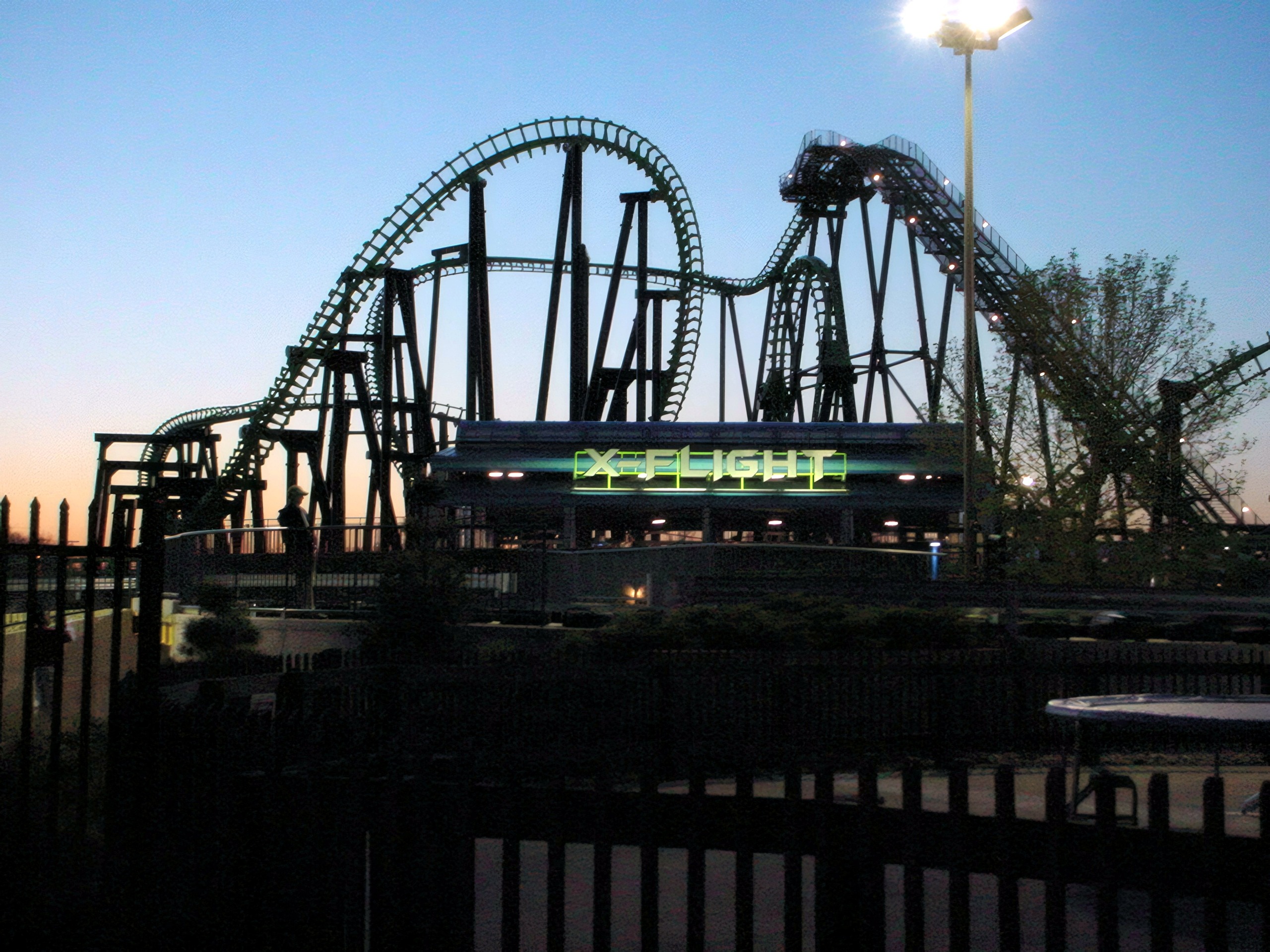 X-Flight and its lit station sign at twilight, May 2002