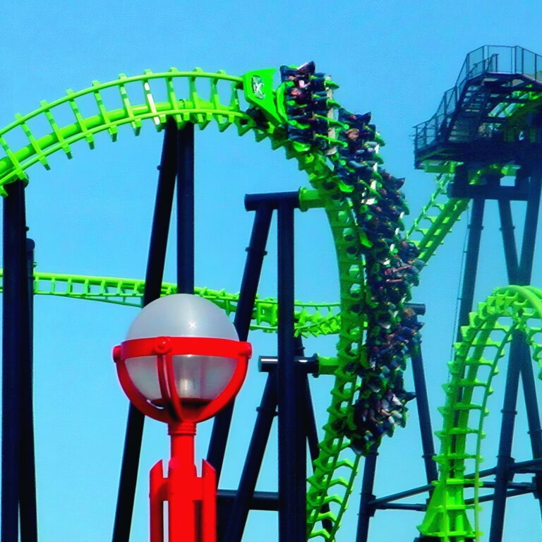 X-Flight at Six Flags Worlds of Adventure, May 4, 2002. Clarendon-style edit.