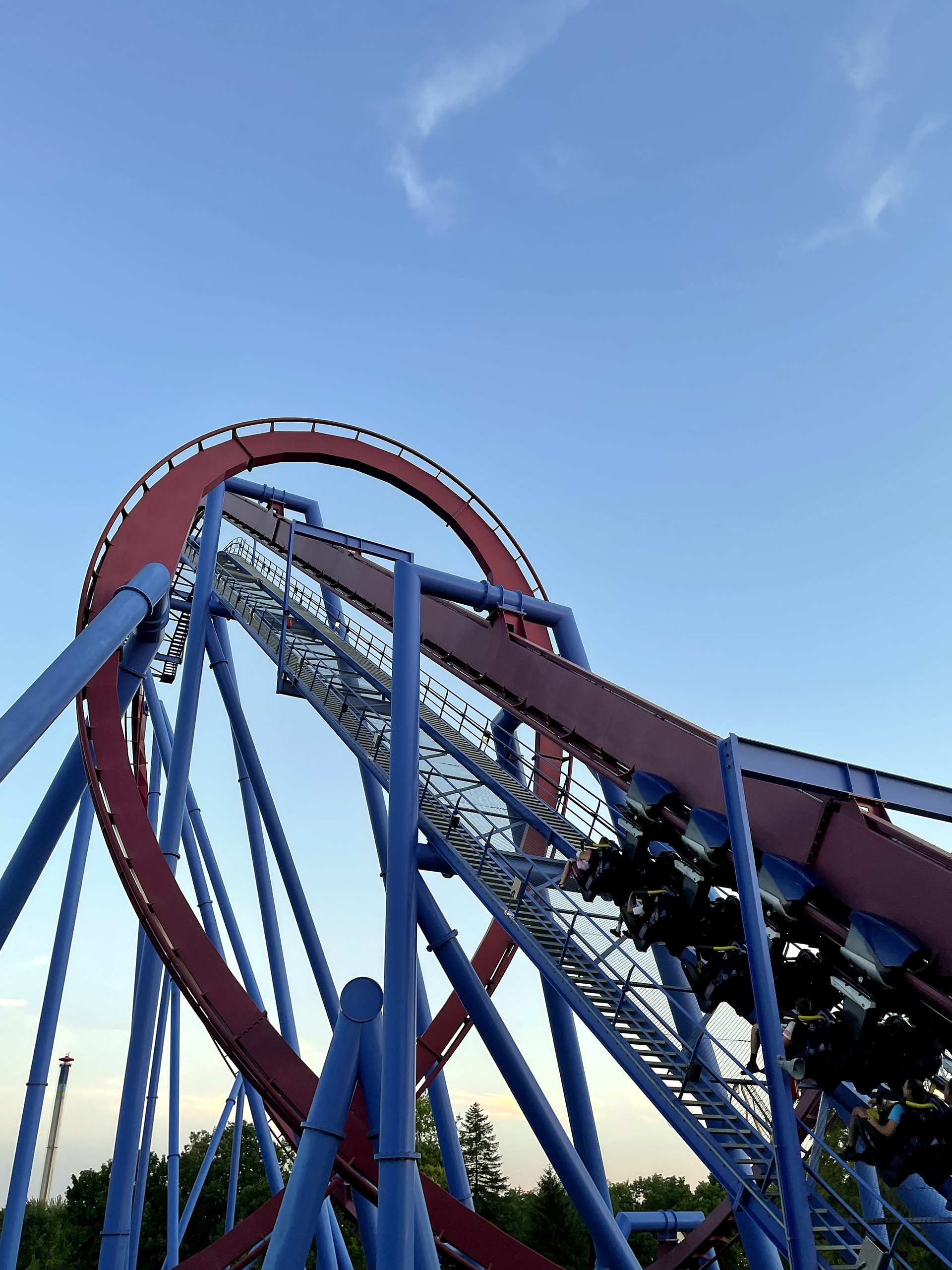 A Banshee train on the lift hill where it runs through the vertical loop, Kings Island, July 2022