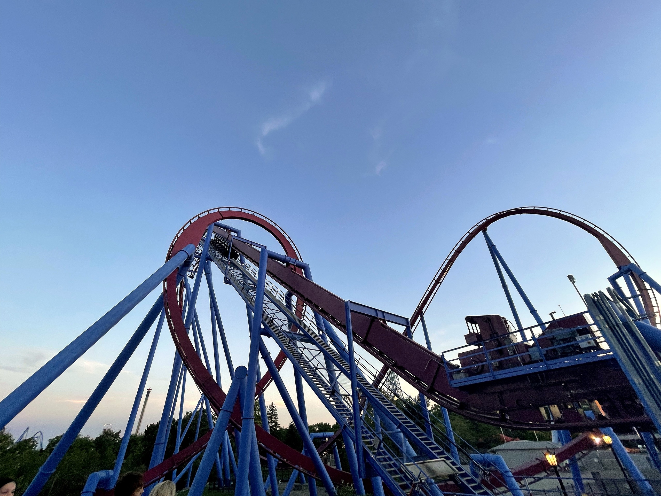 Banshee's loop and lift hill with more of the maroon layout beyond, Kings Island, July 2022