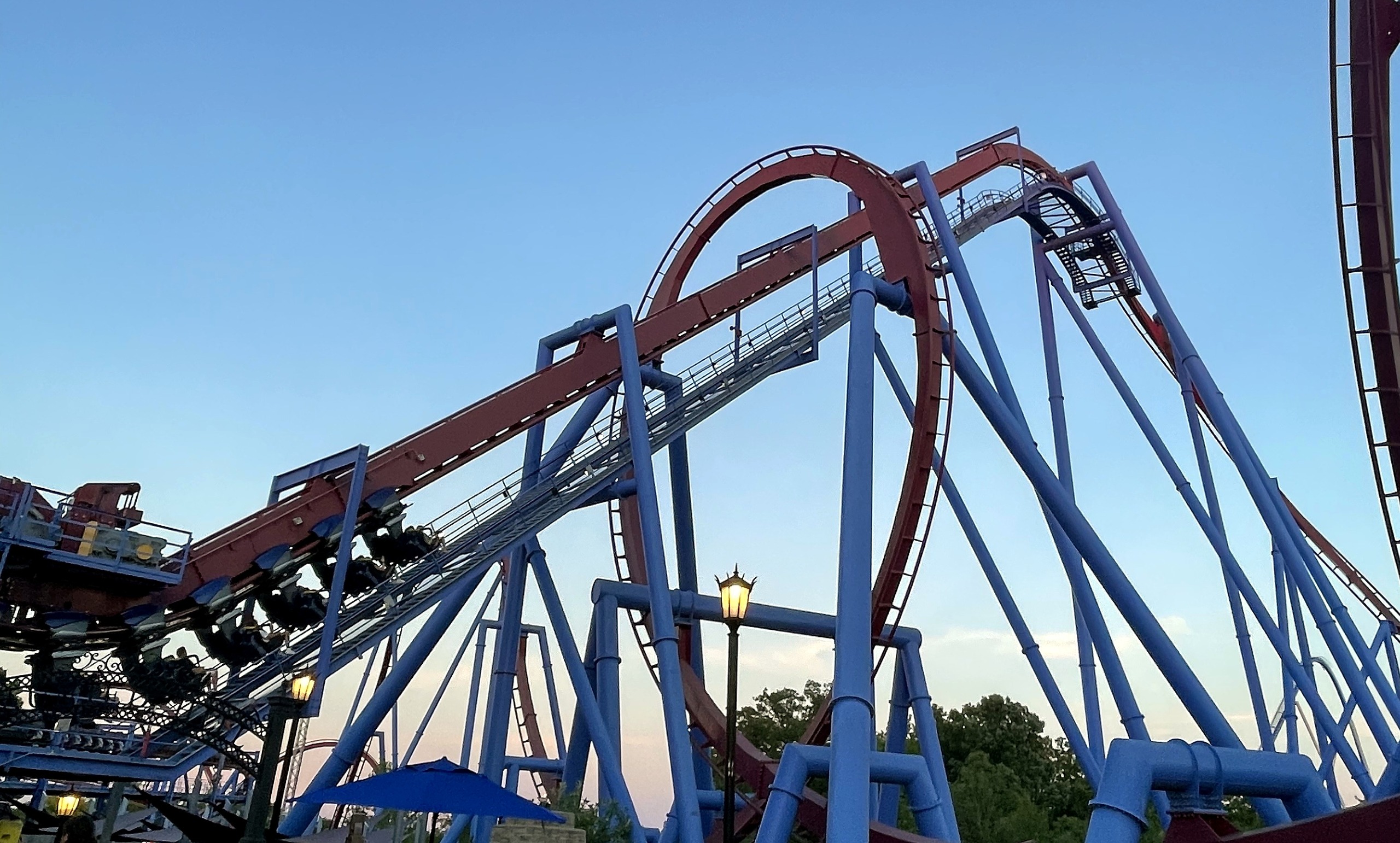 A Banshee train leaving the station toward the lift with the vertical loop beyond, Kings Island, July 2022
