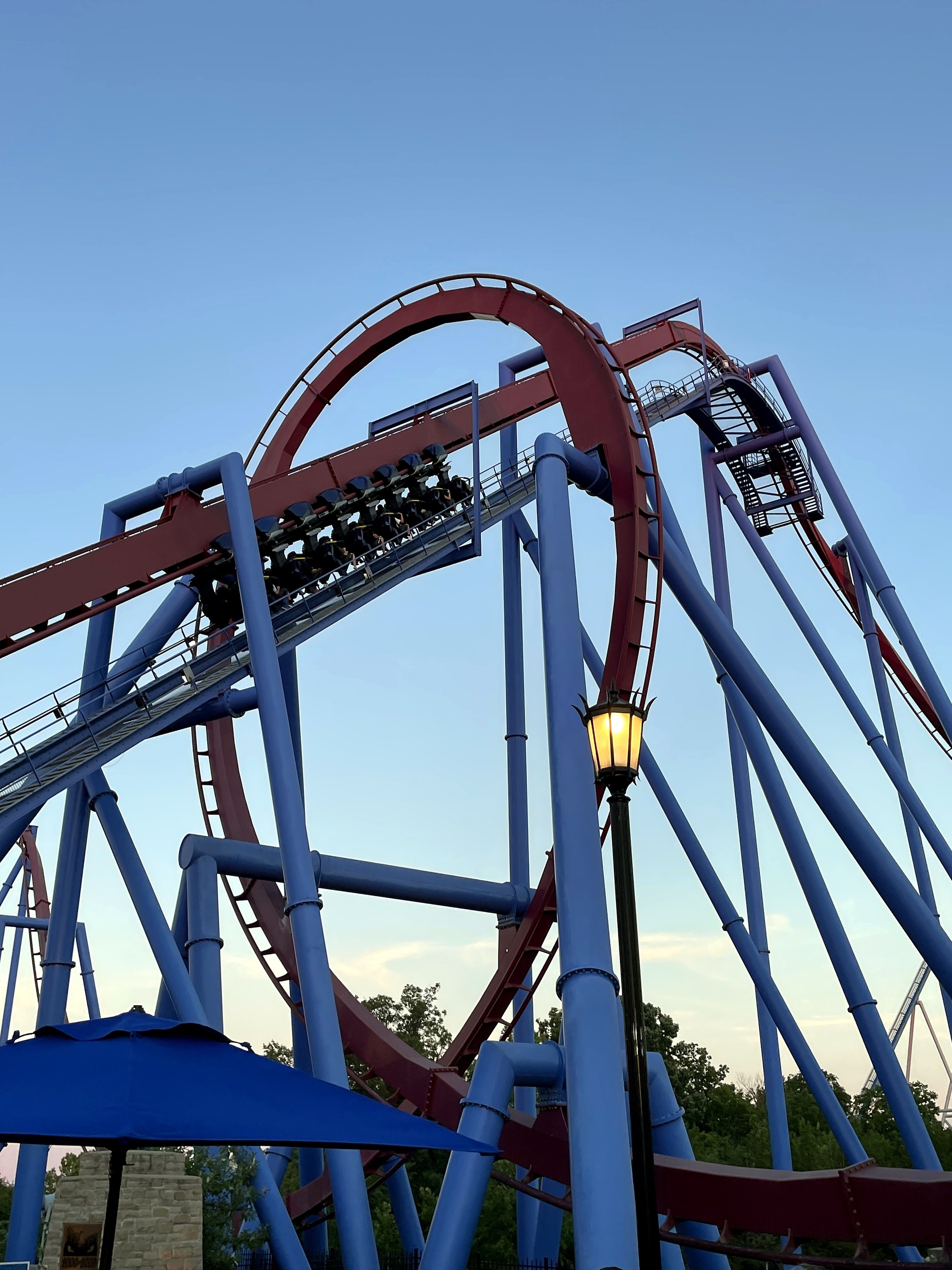 A Banshee train climbing the lift hill inside the vertical loop, Kings Island, July 2022