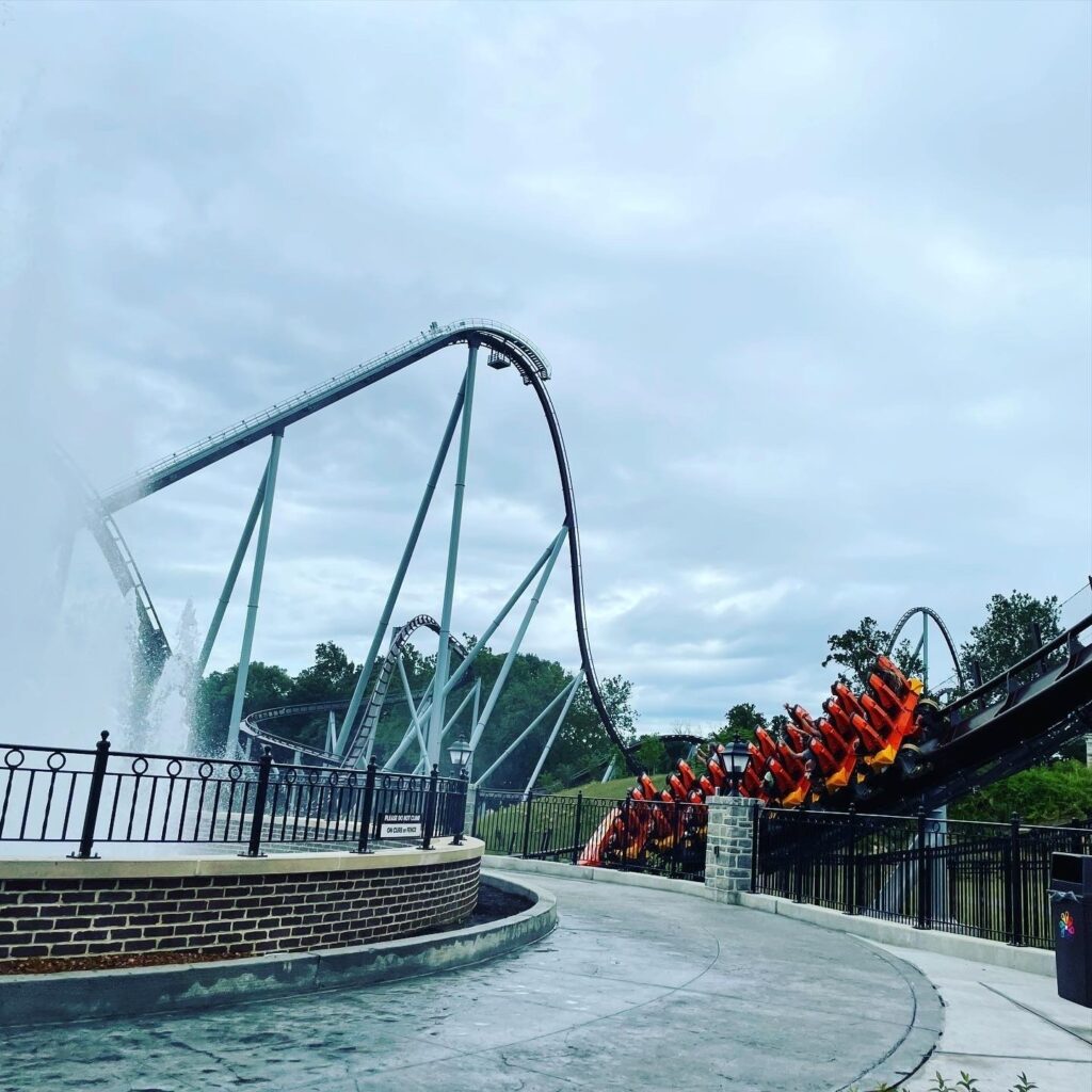 Candymonium's first drop and a train on the turnaround above the Chocolatetown fountain, Hersheypark, June 2021