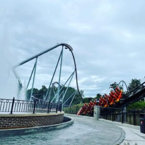 Candymonium's first drop and a train on the turnaround above the Chocolatetown fountain, Hersheypark, June 2021
