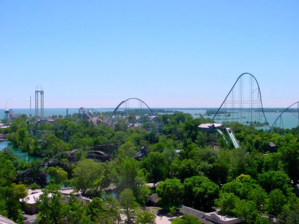 The Cedar Point skyline with Millennium Force and the Power Tower above the trees and Lake Erie at Cedar Point, July 2003