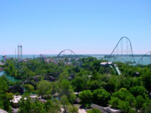 The Cedar Point skyline with Millennium Force and the Power Tower above the trees and Lake Erie at Cedar Point, July 2003