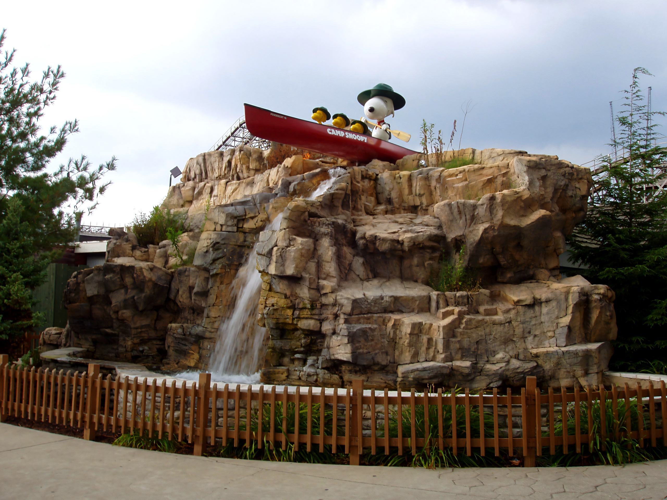 The Camp Snoopy rockwork waterfall topped by a Snoopy canoe statue at Cedar Point, July 2005