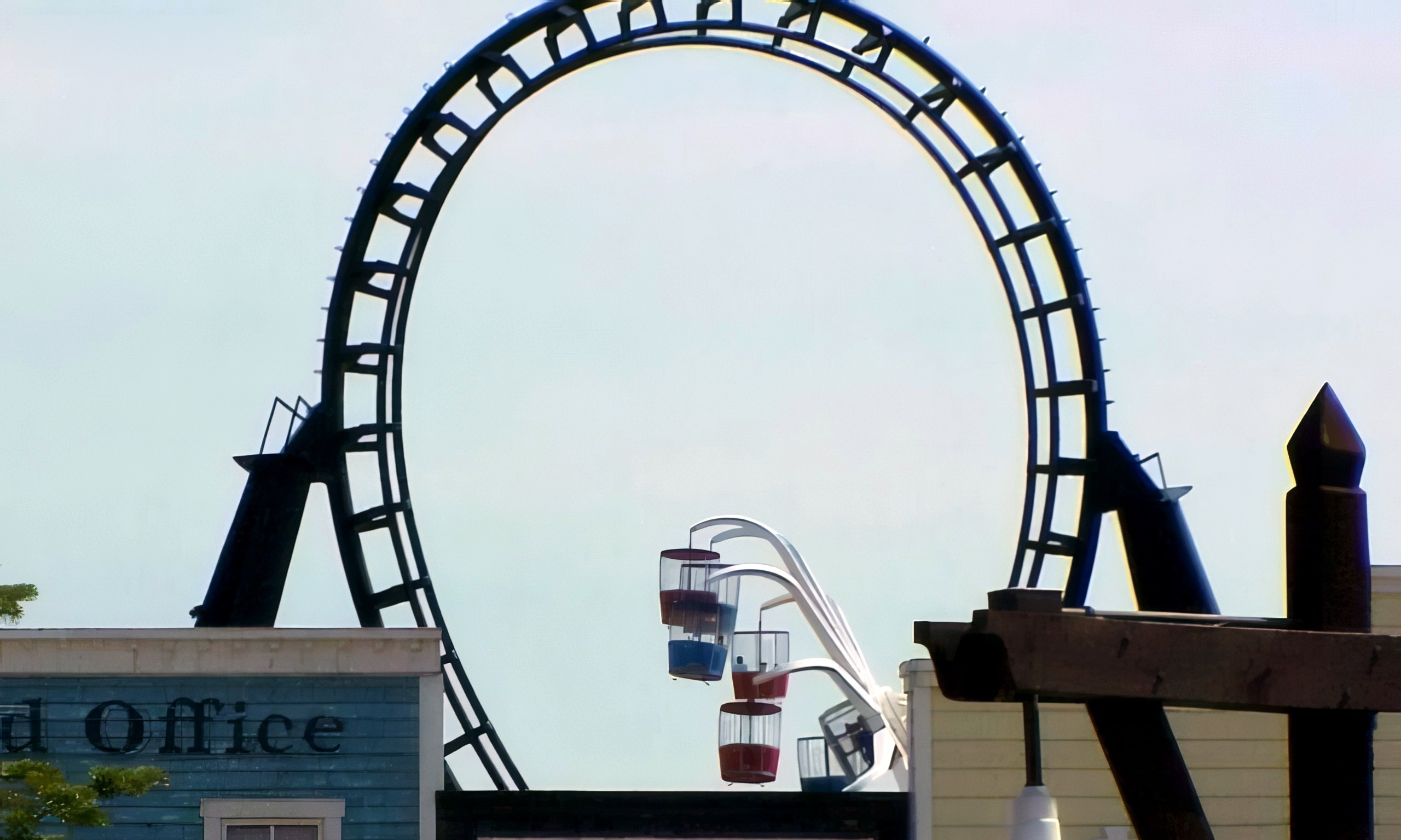 Demon's vertical loop above the Main Street rooftops at Six Flags Great America, 2000