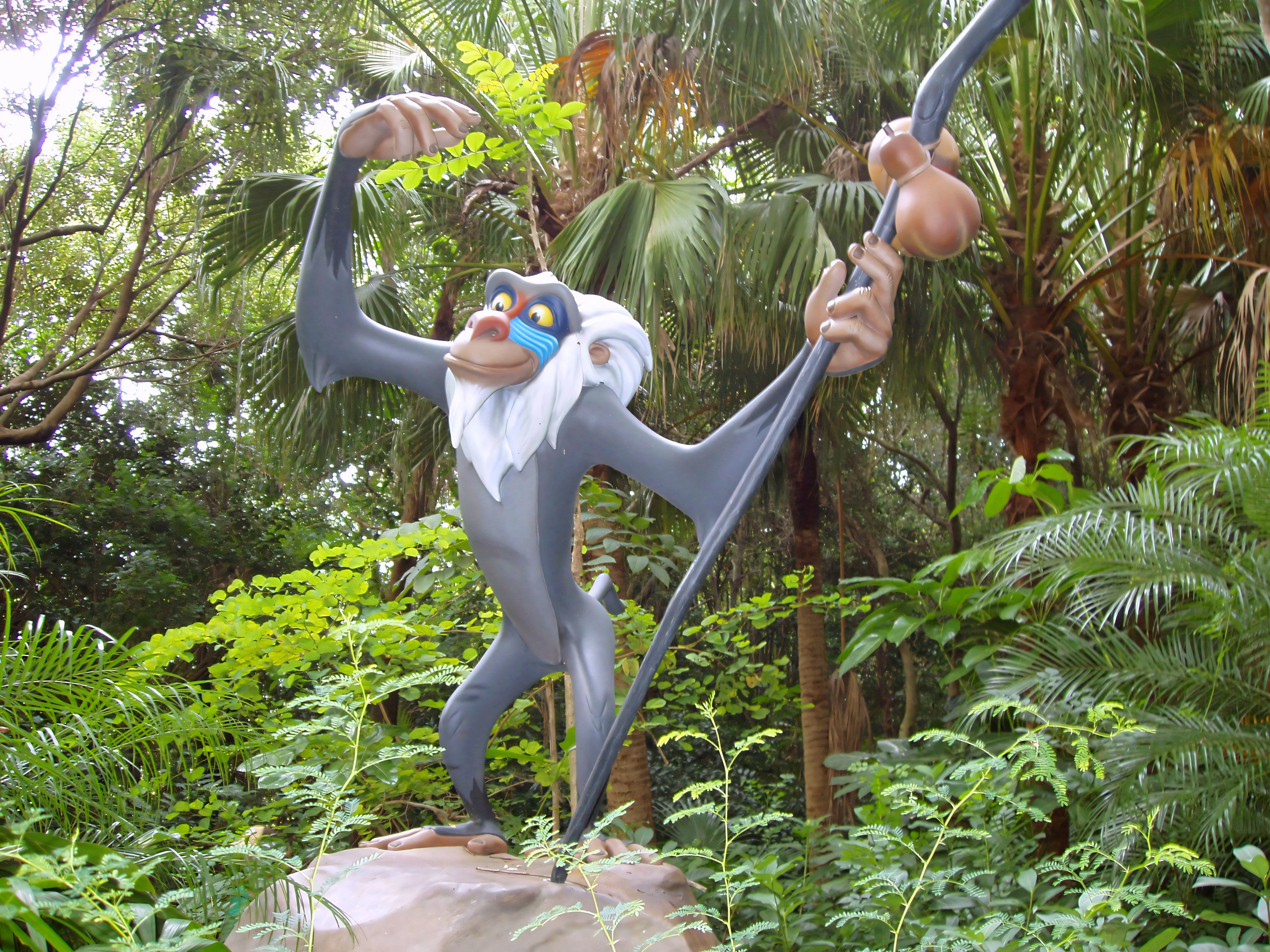 Rafiki character statue amid jungle foliage, Disney's Animal Kingdom, June 2006