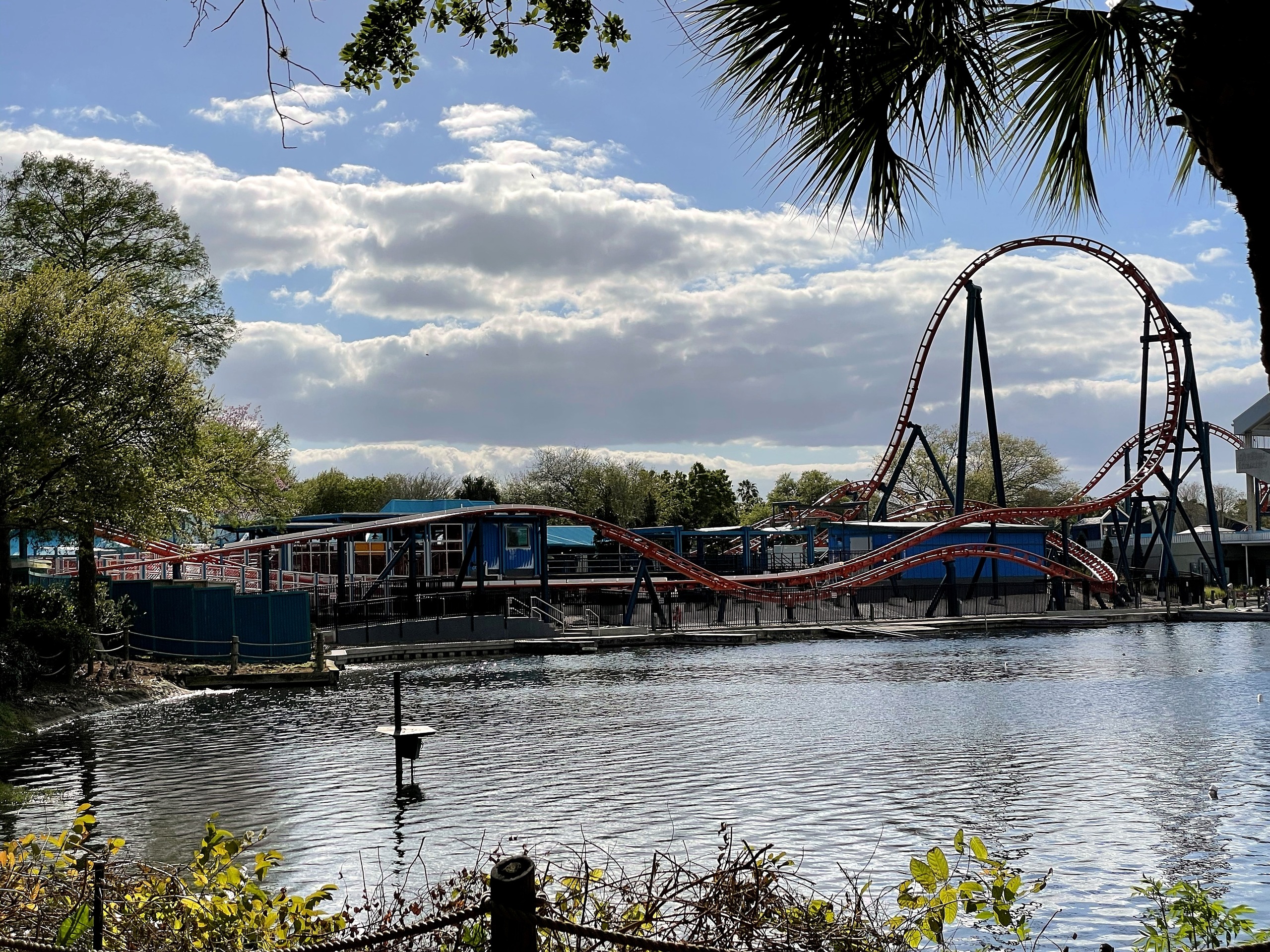 Ice Breaker's orange track, spike and top hat across the lake at SeaWorld Orlando, March 2021