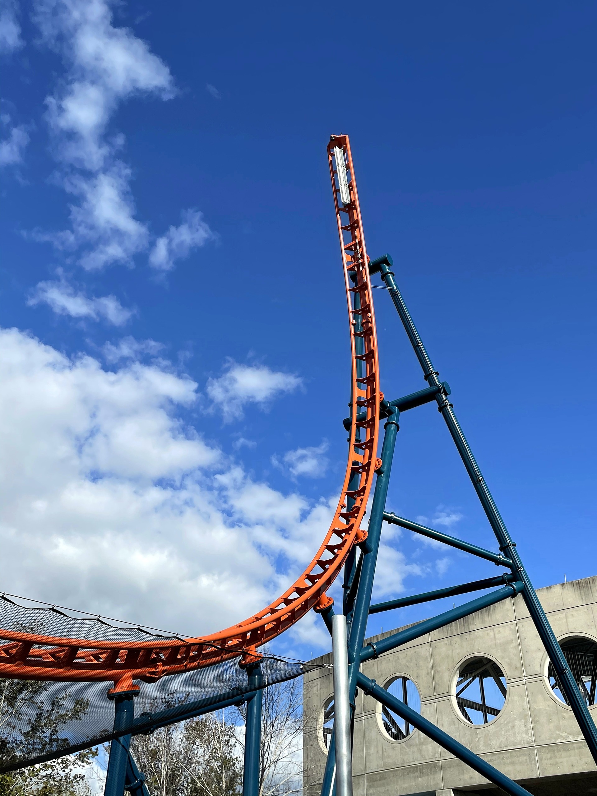 Ice Breaker's orange track curving up into the rear spike at SeaWorld Orlando, March 2021