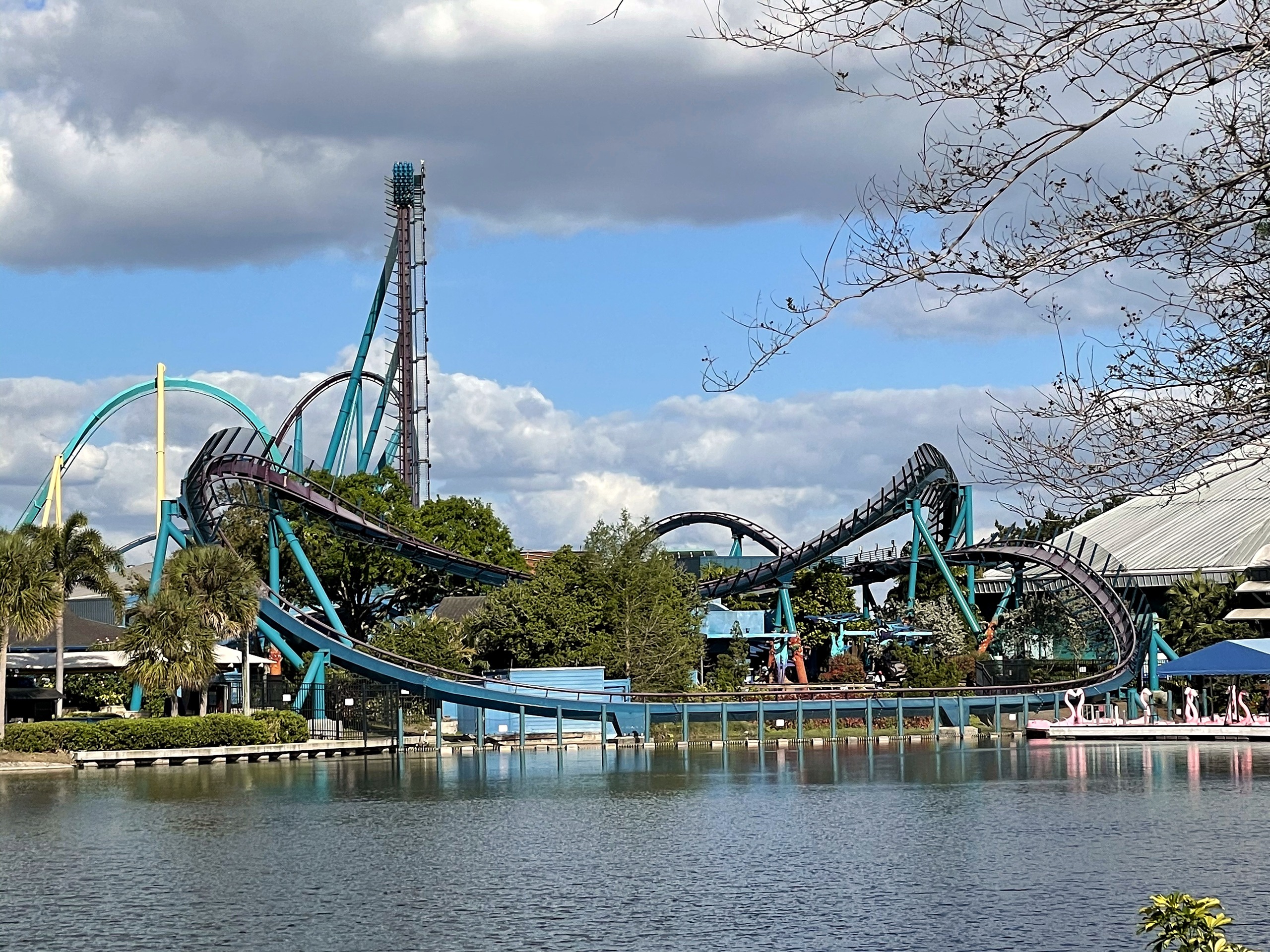 Mako's track along the lakeshore with the lift hill rising behind at SeaWorld Orlando, March 2021