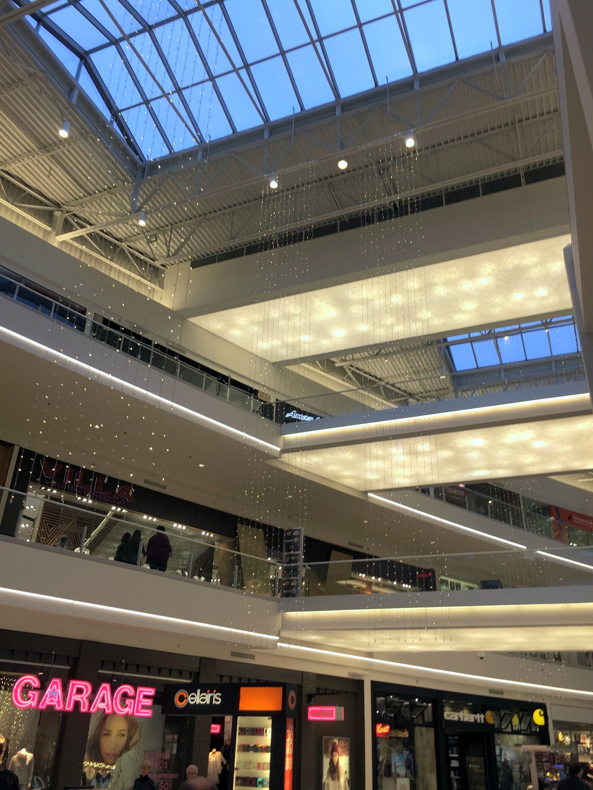 The mall atrium with strings of holiday lights under the skylights at Mall of America, November 2015