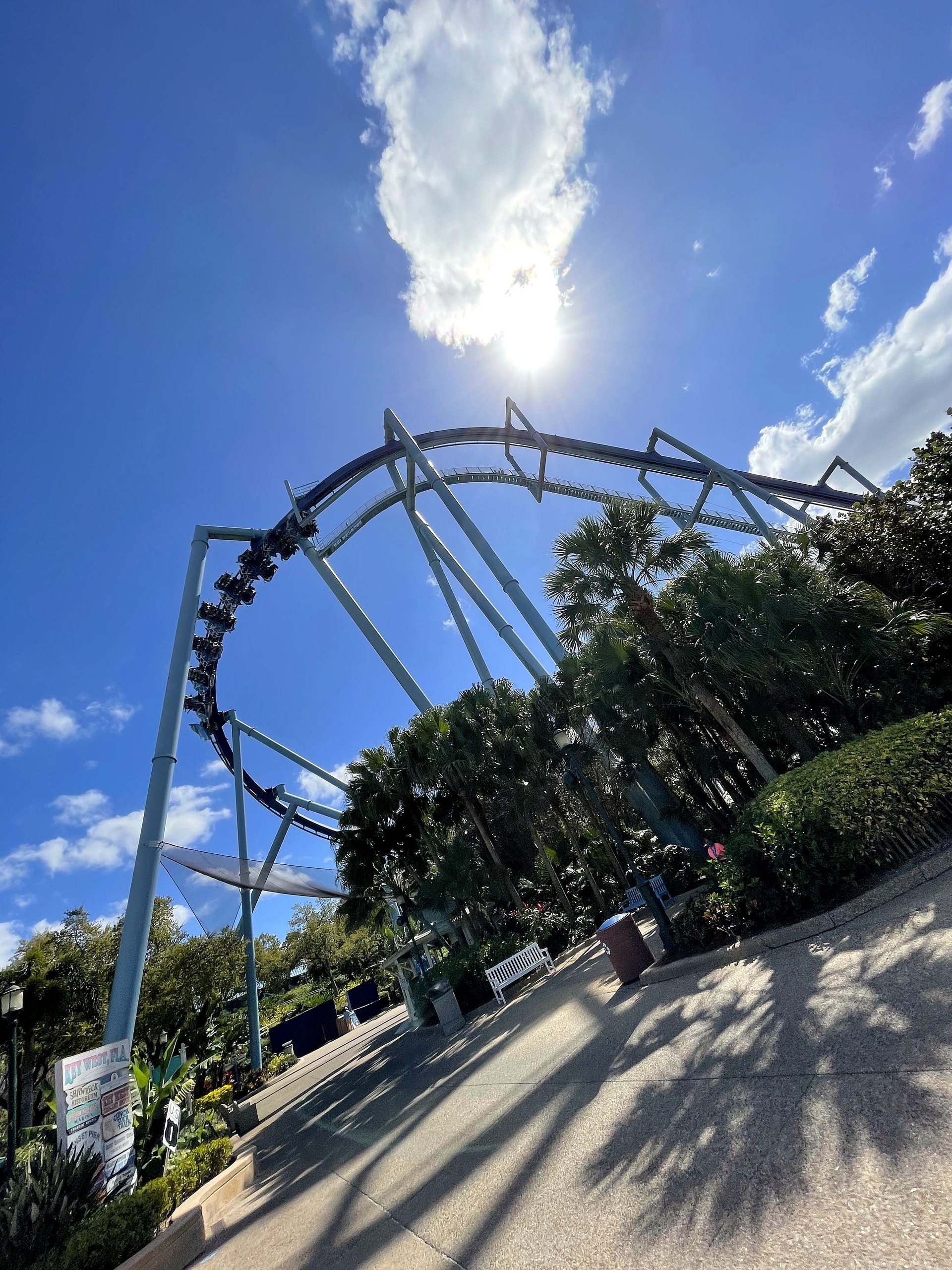 A Manta train in the loop with the sun behind the structure at SeaWorld Orlando, March 2021