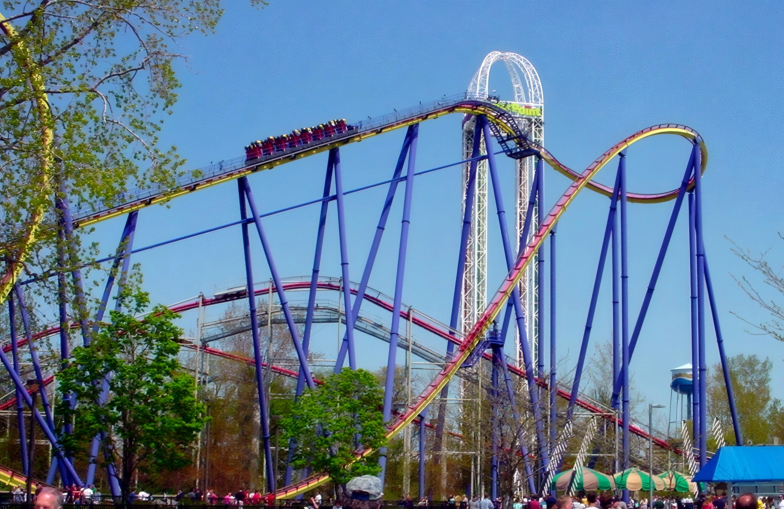 Mantis train on the lift with the vertical loop and dive loop behind, Mantis at Cedar Point