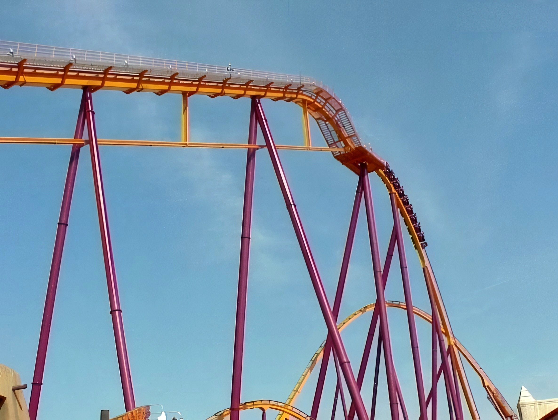 A Raging Bull train diving down the first drop from the lift hill crest at Six Flags Great America, 2000