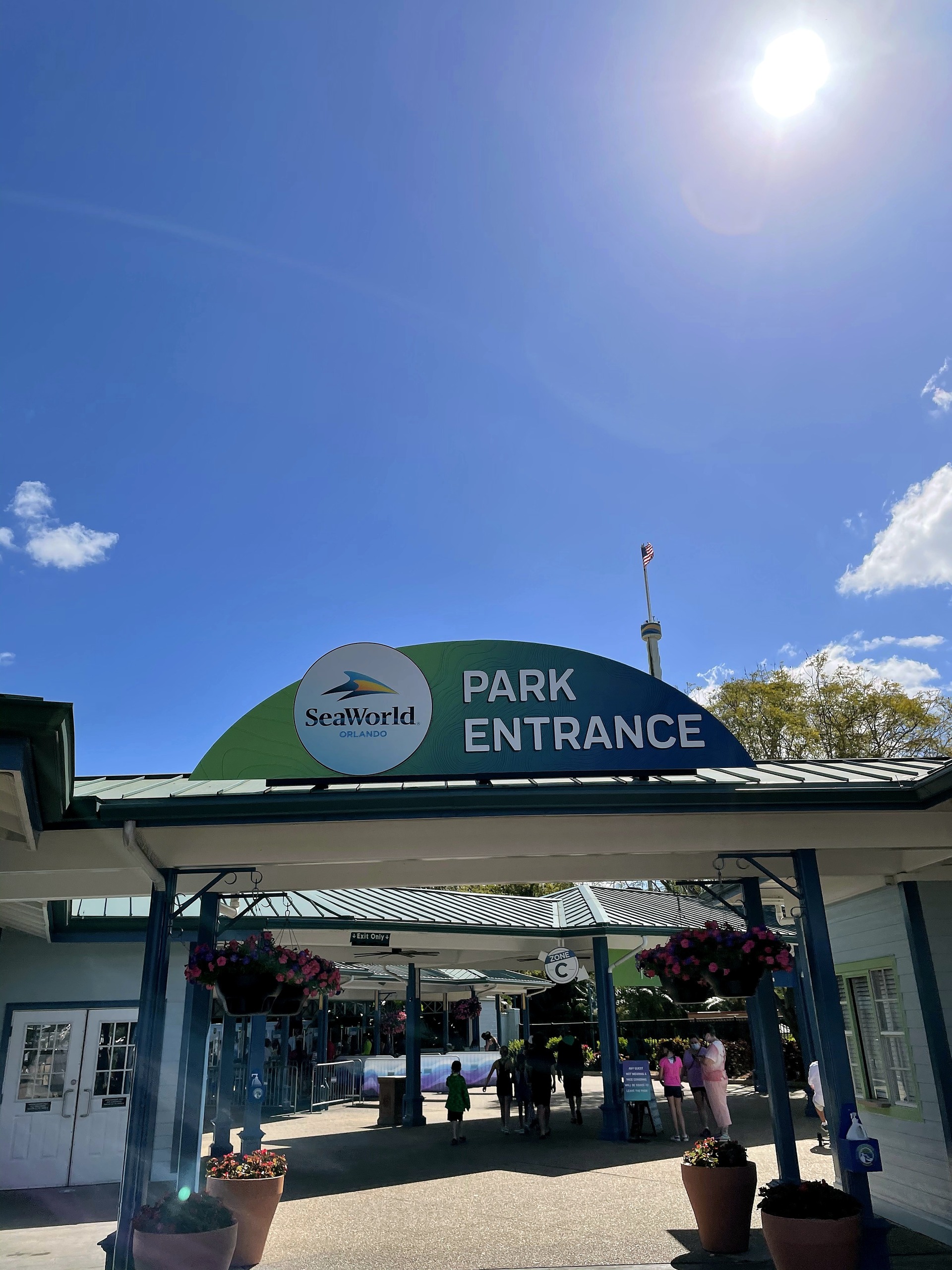 The Park Entrance gate with the Sky Tower behind it at SeaWorld Orlando, March 2021