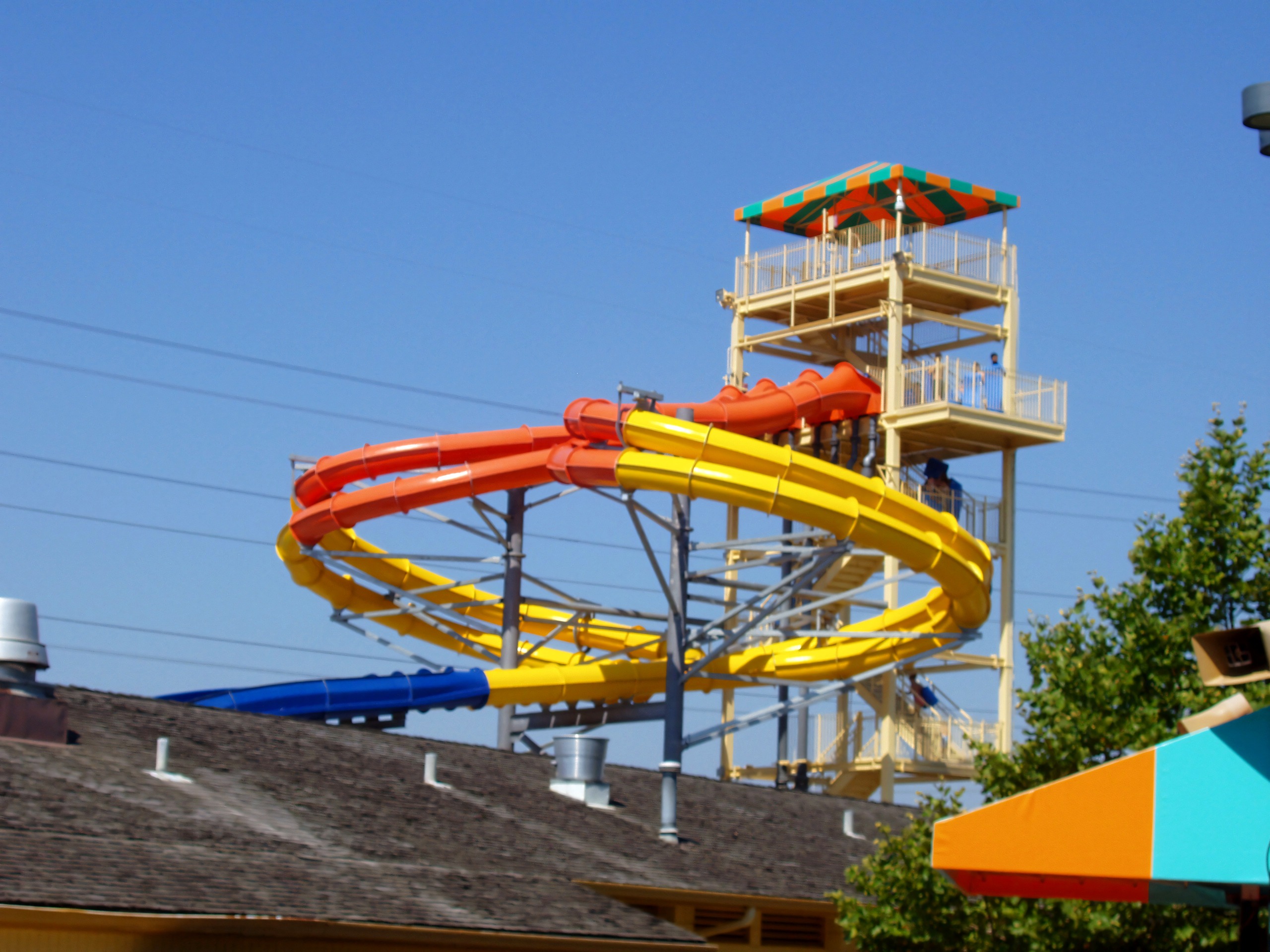 The orange and yellow spiral slides wrapping around their tower above the rooftops at Kings Island's water park, then Boomerang Bay and now Soak City, July 2005