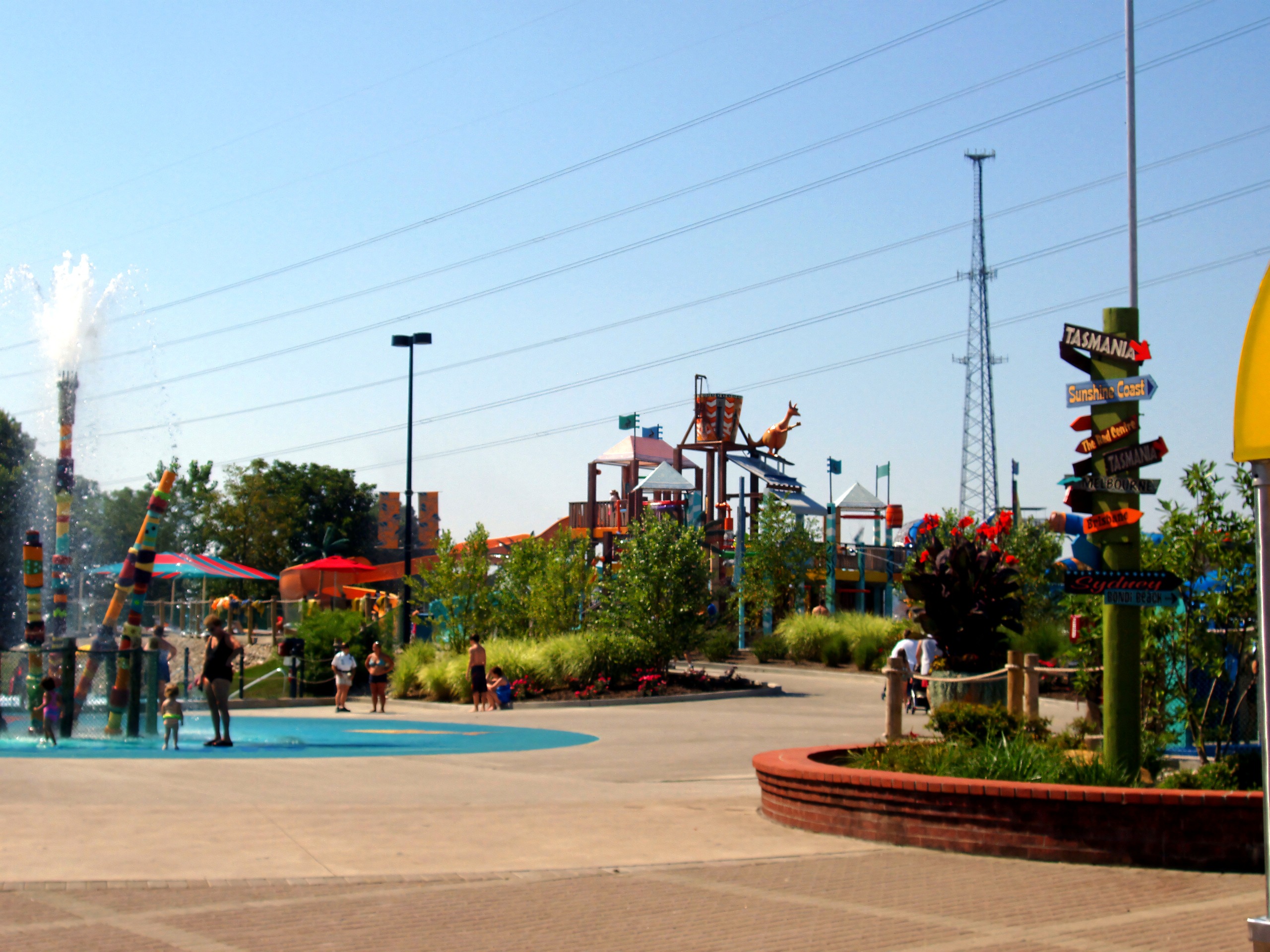 The splash pad plaza and signposts, slide towers beyond at Kings Island's water park, then Boomerang Bay and now Soak City, July 2005