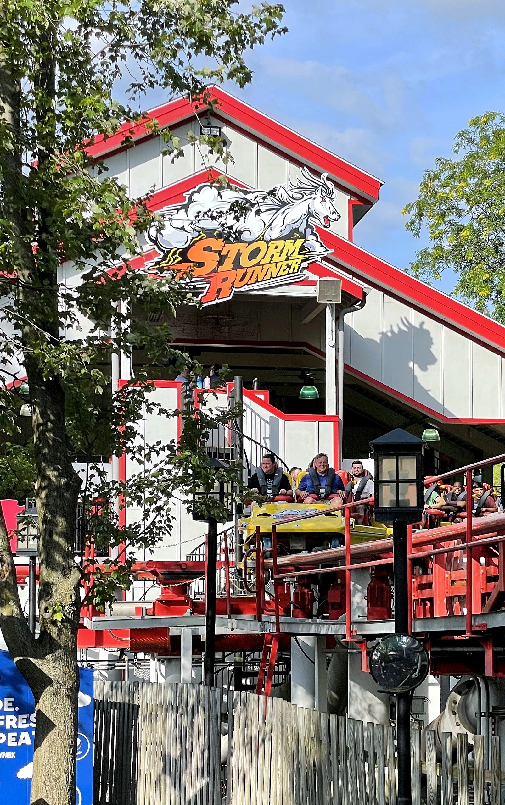 A Storm Runner train in the station under the Storm Runner sign at Hersheypark, June 2021